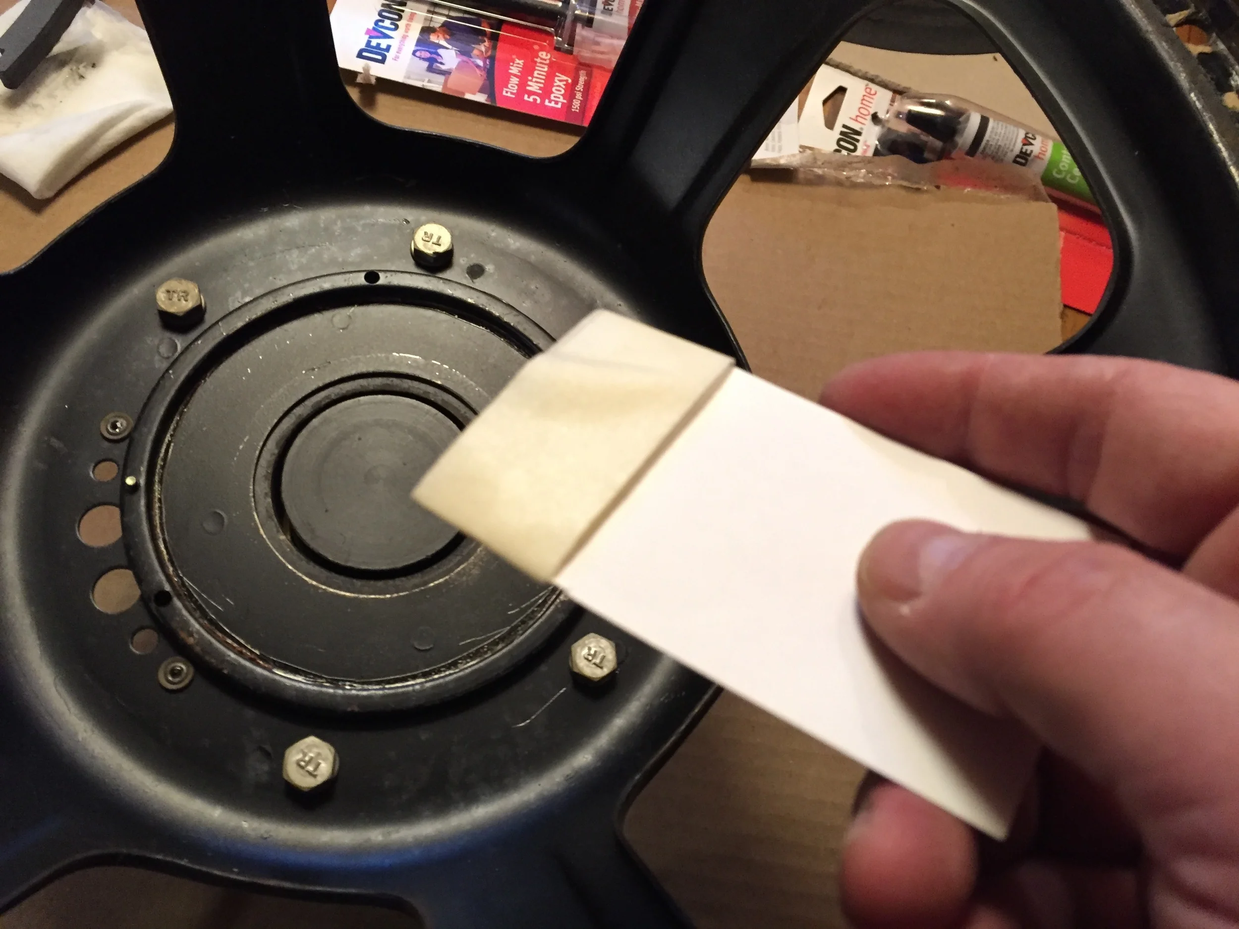 Cleaning the gap with a card and masking tape.