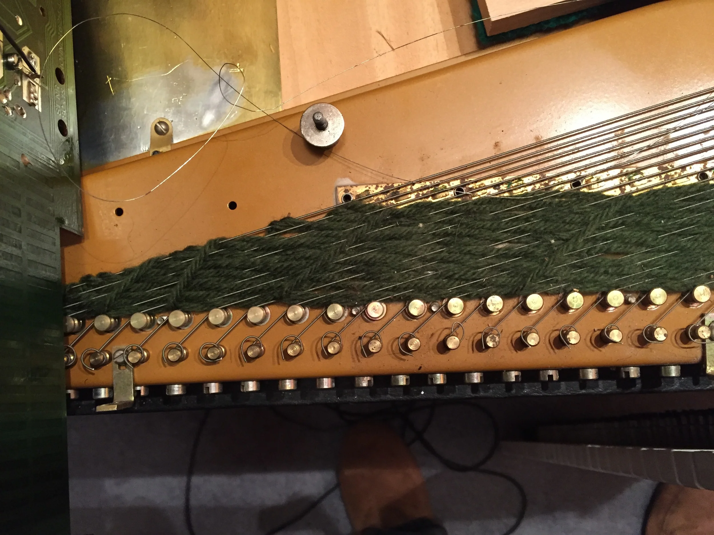 A closeup of the old yarn and strings.
