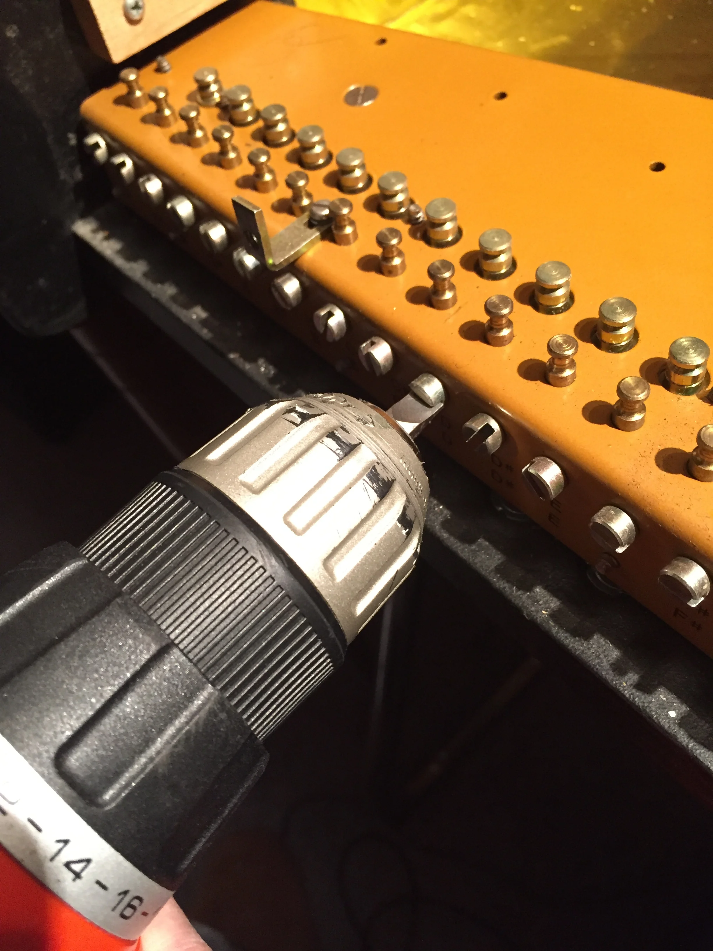 Aligning all the tuner holes for easier restringing.