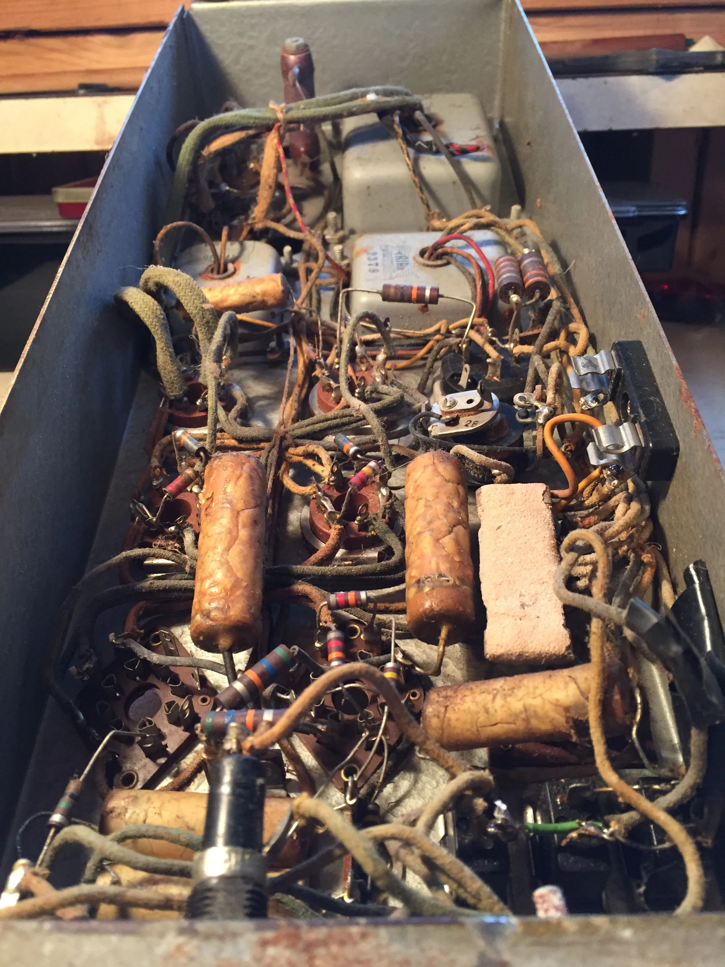 The caps, resistors, and relay are toast. Lots of rewiring evident.