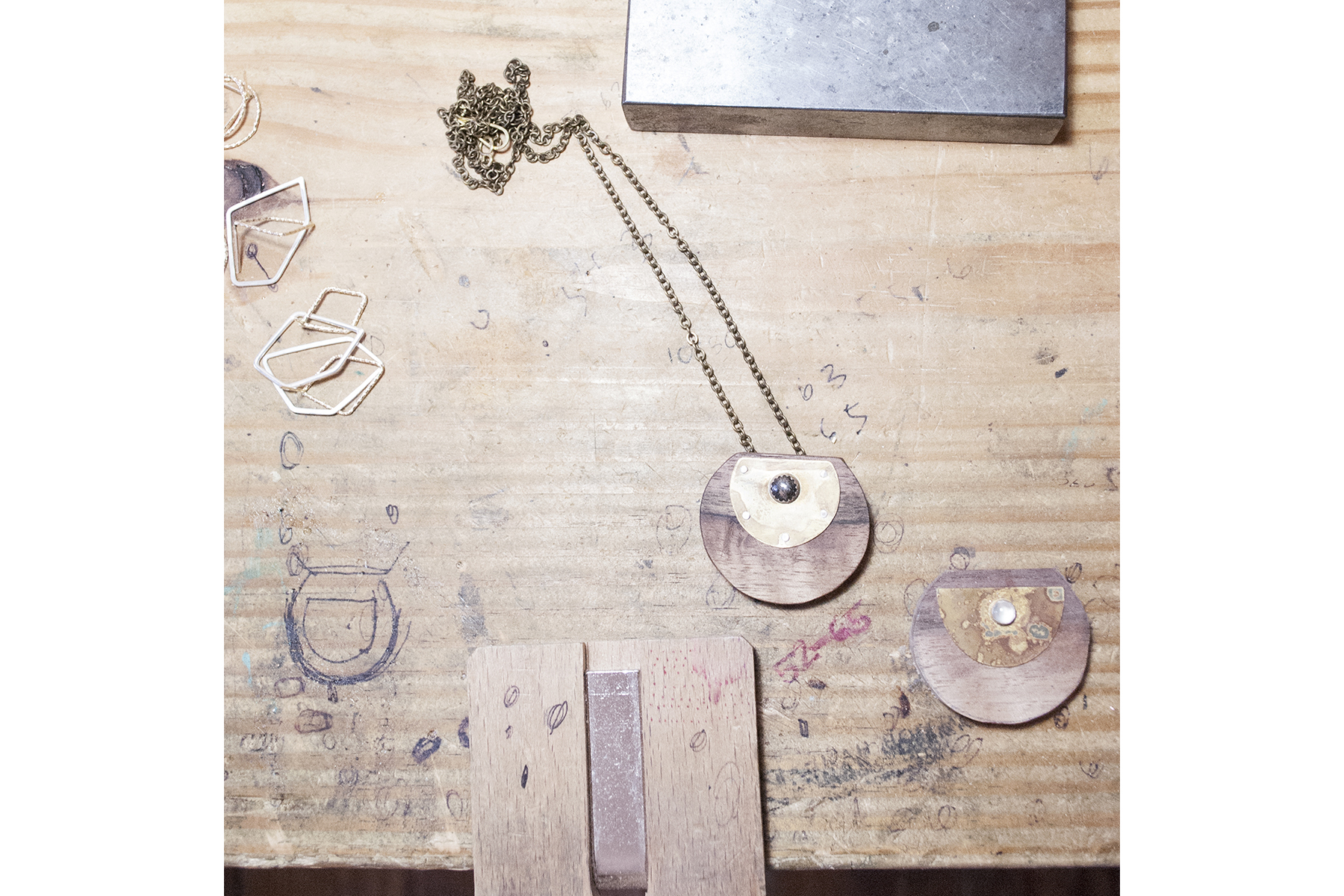 A pendant and an in-process pendant.