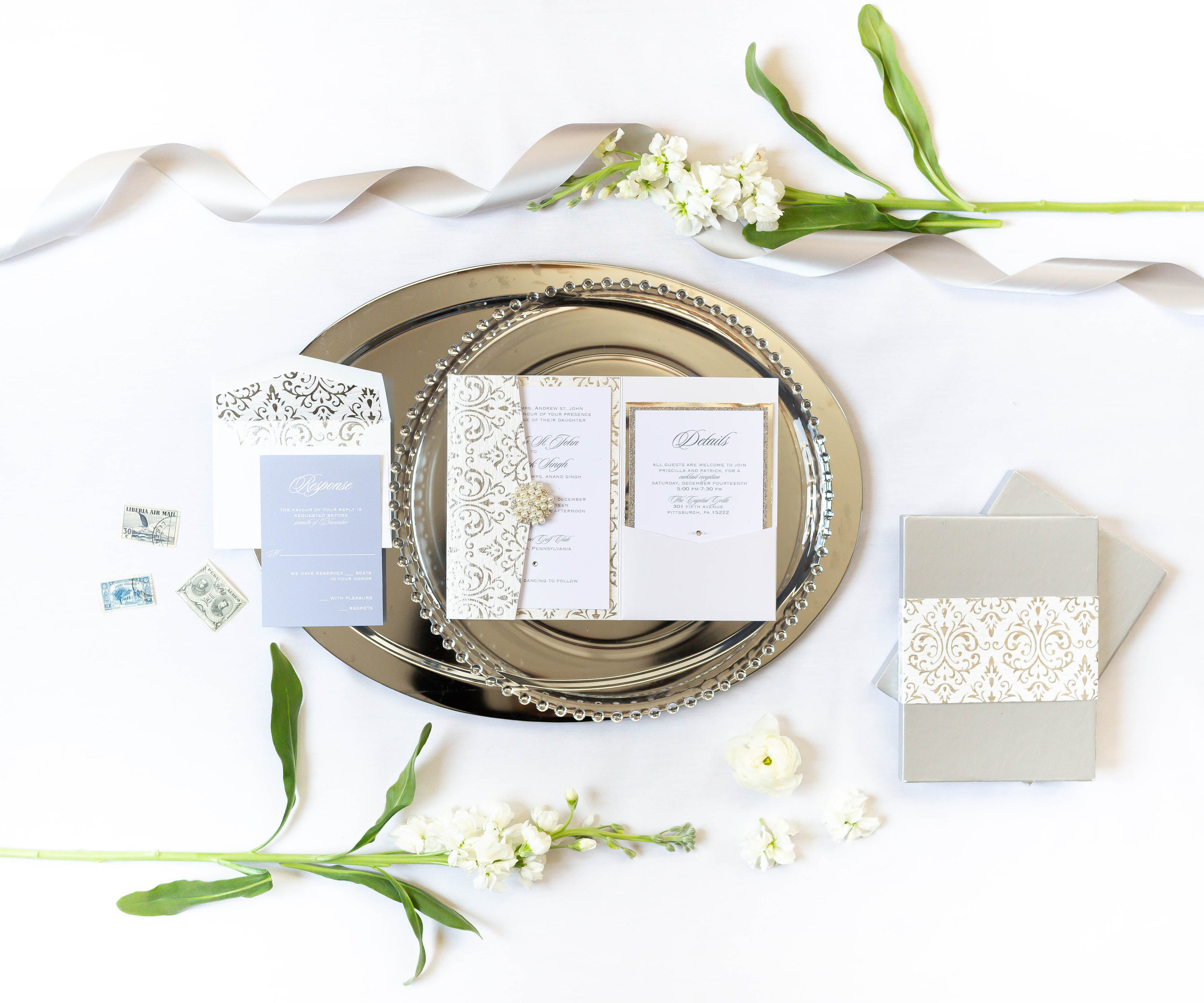 The possibilities are endless with custom invitations. I design your suite with all the details that are important to you. You can have your choice of silk ribbons, luxury paper, wax seals, couture mailing boxes and all the crystals your heart desires. You can truly have everything you want, with a Custom Stationery Design. This is a full service design studio, so your invitations will arrive fully assembled and ready for mailing. Complete the Contact Form today get to started with your design.