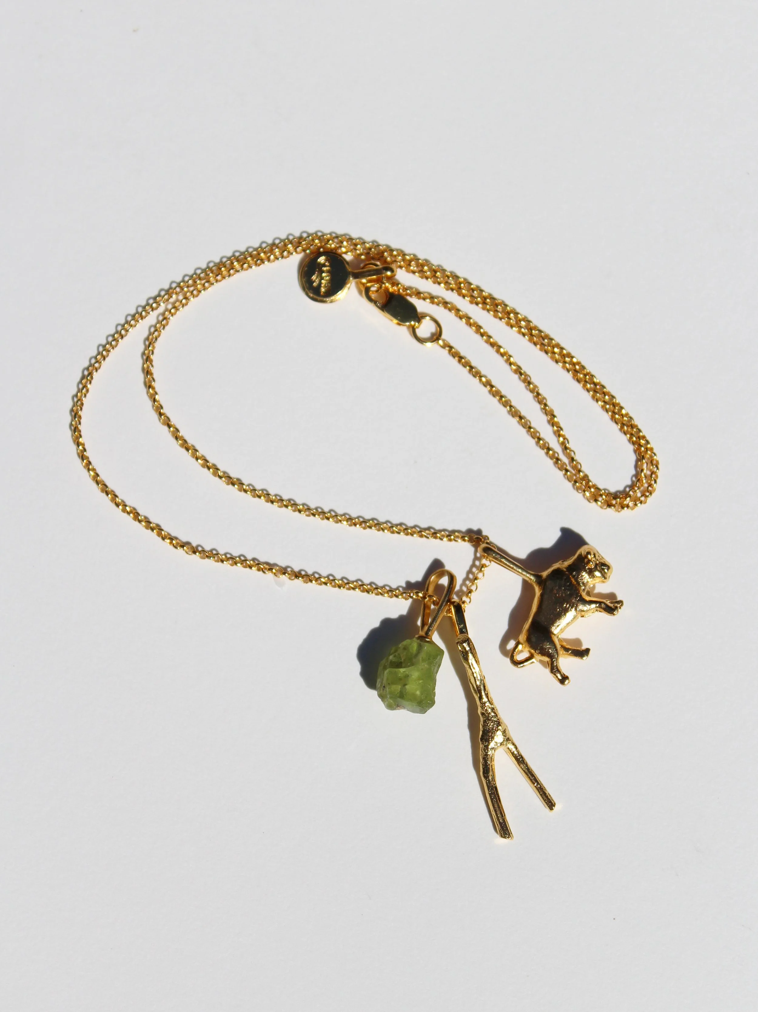 Buffalo, Peridot & Wishbone stick charms on 18" chain