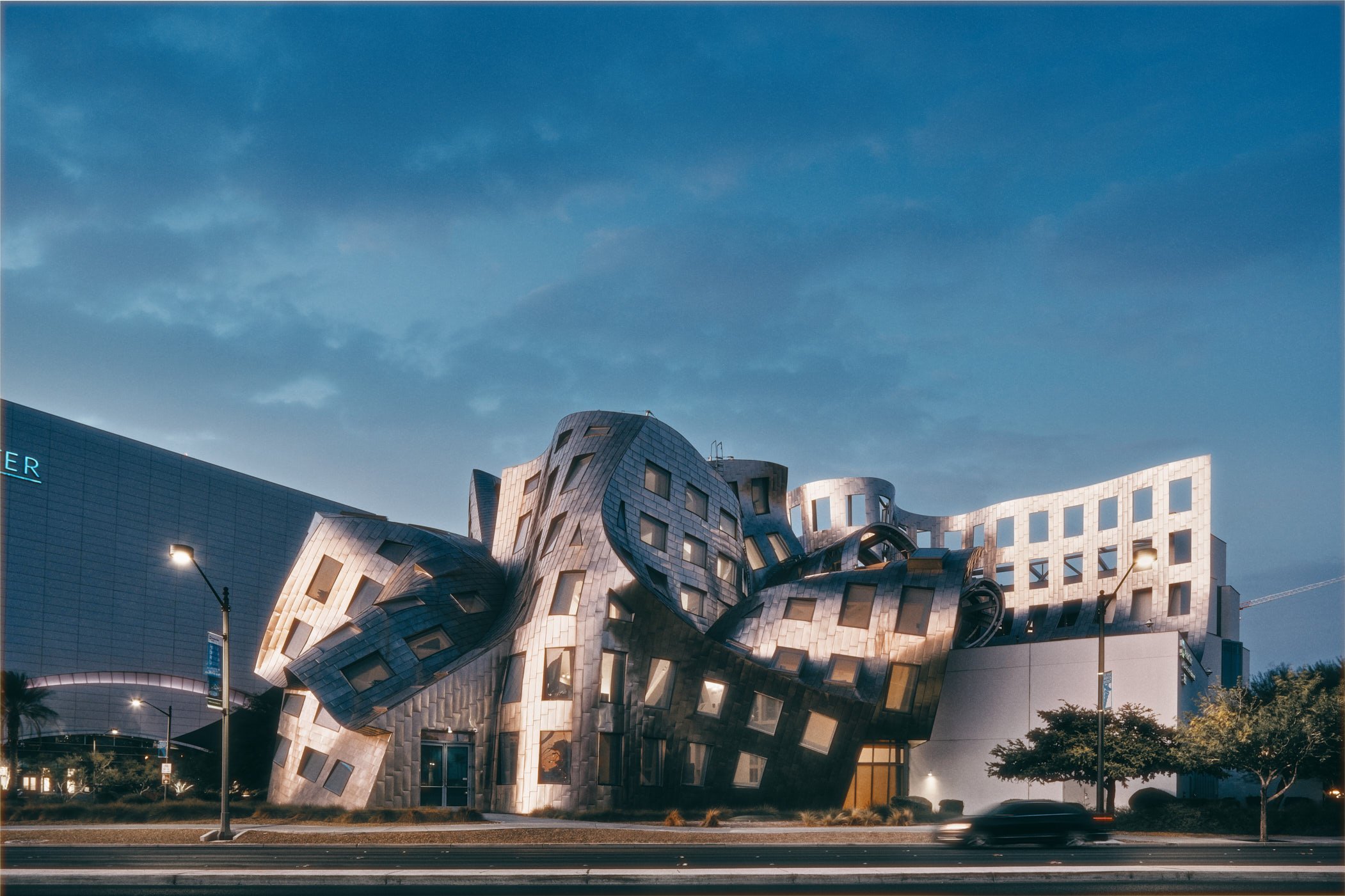 An architectural photograph of the Cleveland Clinics Lou Ruvo Center for Brain Health in Las Vegas, Nevada. Shot at dusk by Miami & Los Angeles based architectural photographer Christian Santiago.