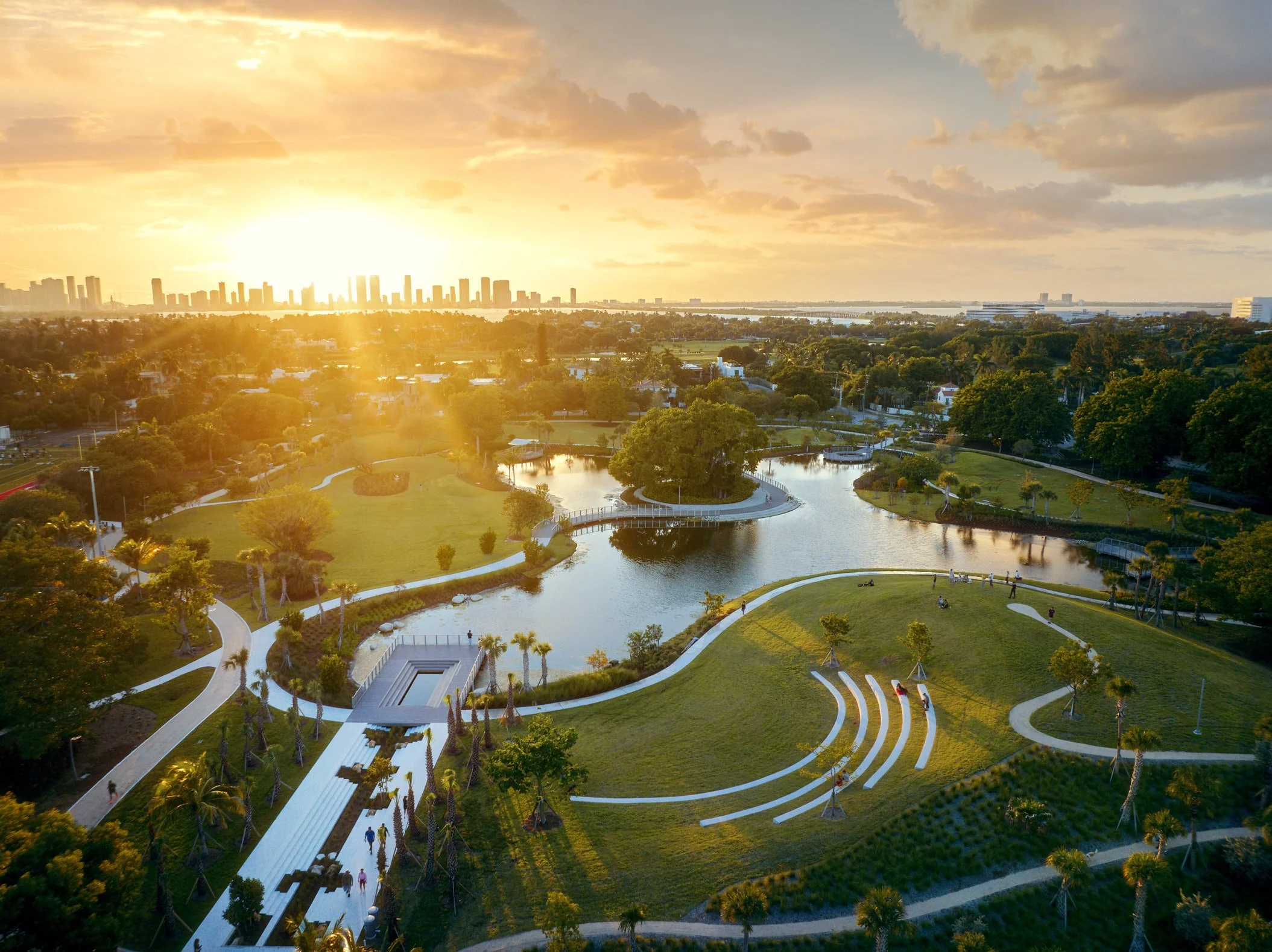 Aerial architectural photograph of Bayshore Park at Sunset in Miami Beach. The Miami skyline stands tall in the background. Captured by Miami architectural photographer Christian Santiago