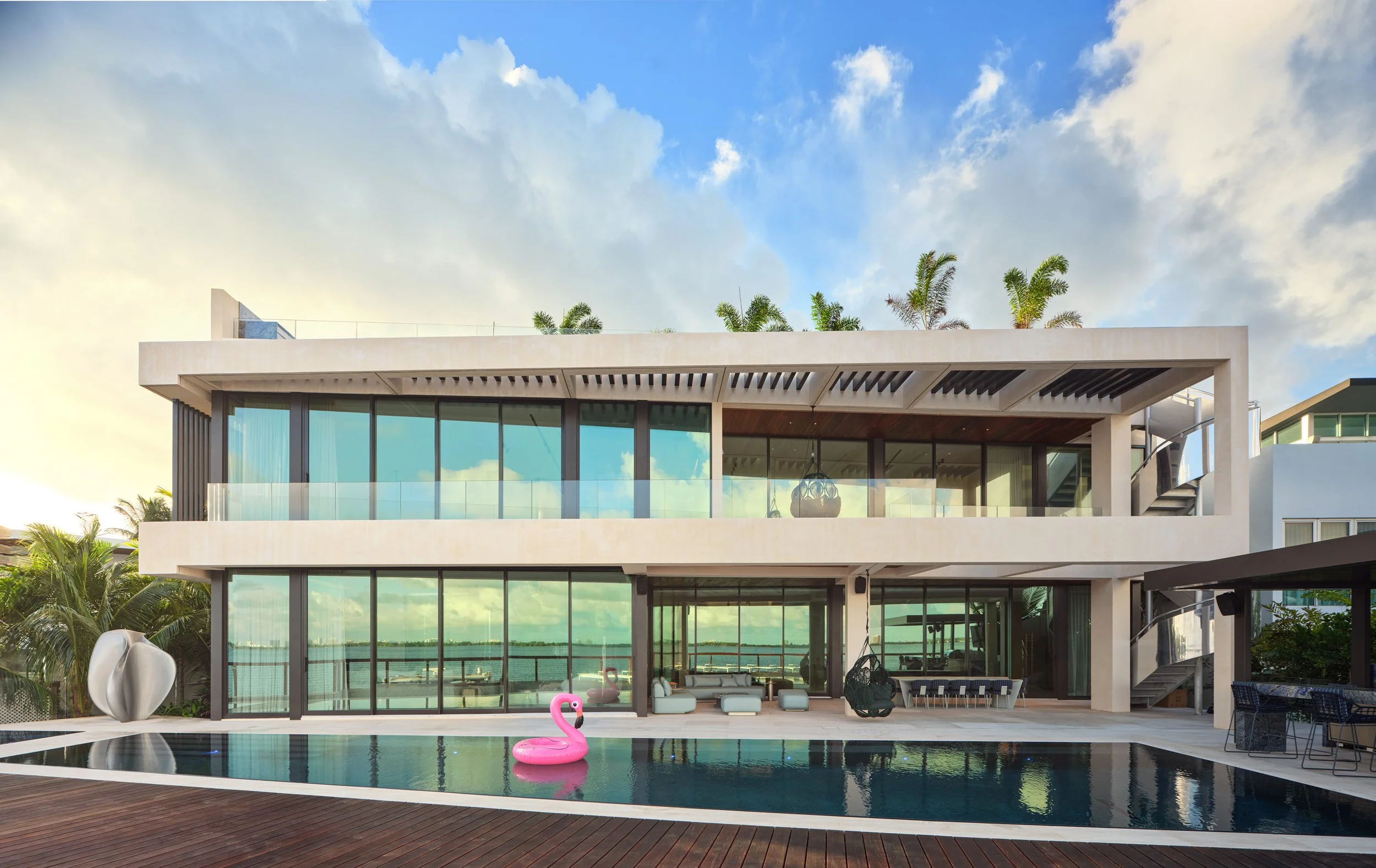 Architectural photograph of a modern waterfront residence with pool on the Venetian Islands in Miami. Captured by Miami and Los Angeles-based architectural photographer Christian Santiago
