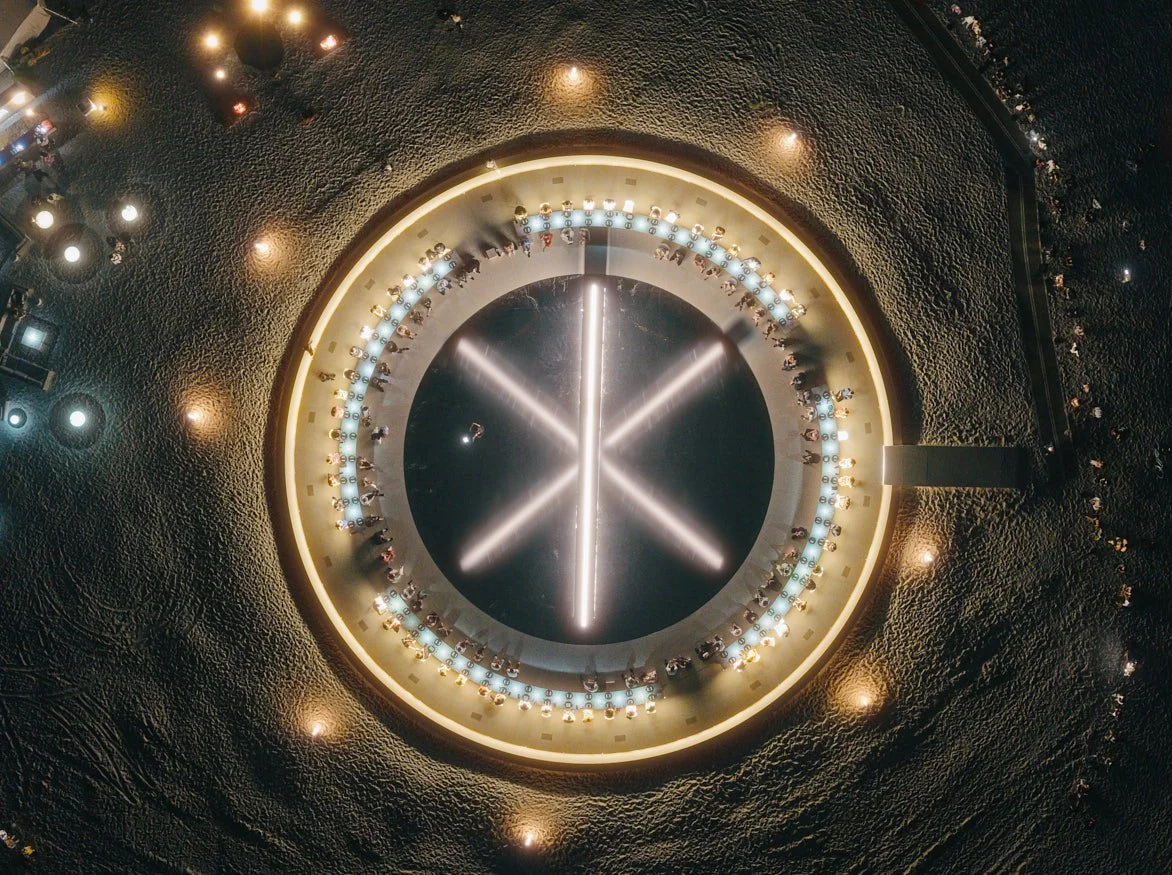 Architectural drone photograph of ES Devlin's LIbrary of Us at Art Basel Miami Beach, featuring a circular illuminated dining installation viewed from above. Captured by Miami Architectural Photographer Christian Santiago