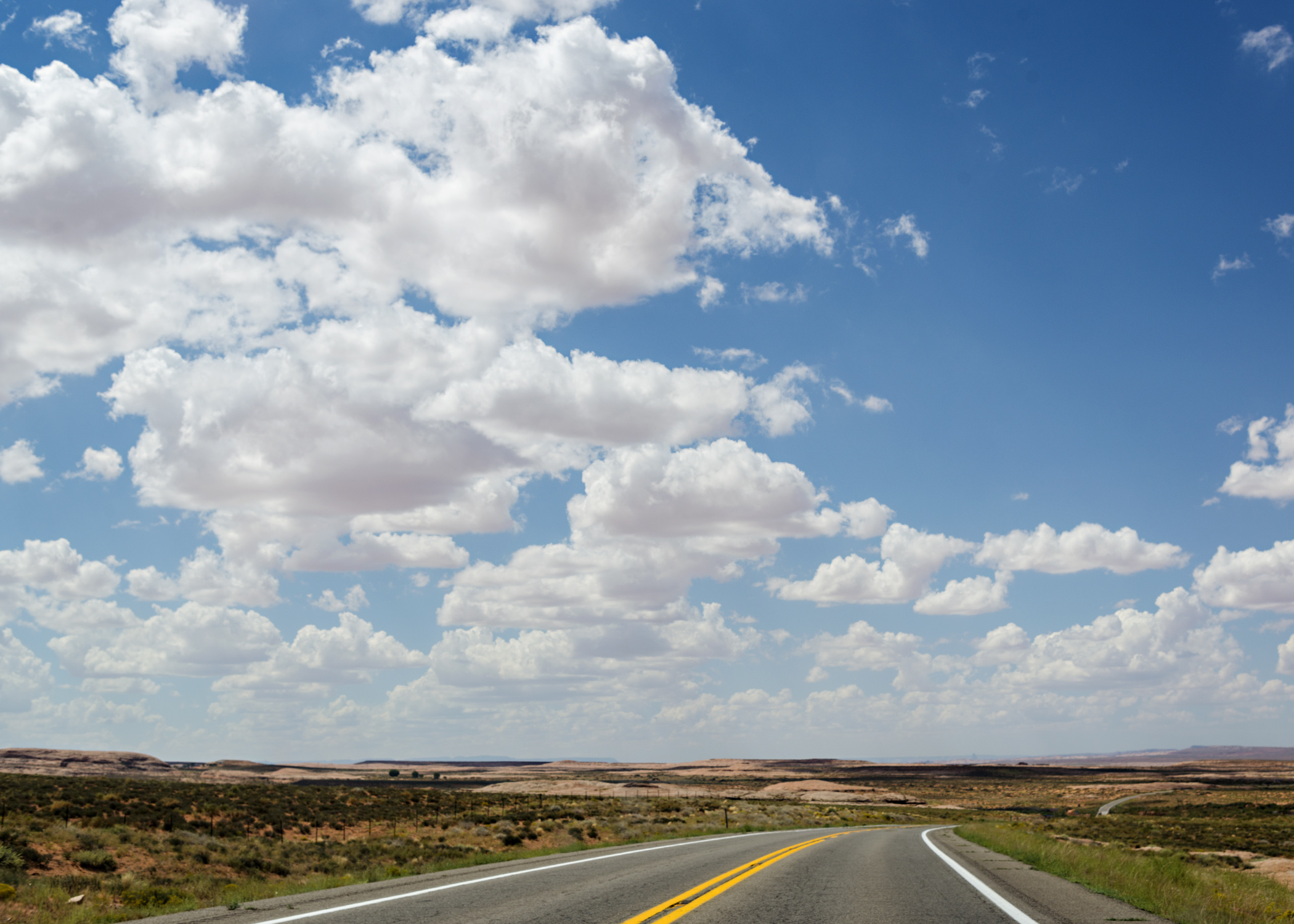 The sky stretches out over endless desert in the Four Corners region. Nikon D800, 24-120mm lens @ 44mm, iso 100, f6.3, 1/800 sec.
