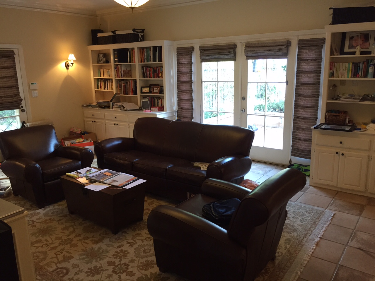 Family room before. I had already cleared out eight or nine boxes from the lefthand side of the frame, so it doesn't fully capture the state of decay. iPhone 6.