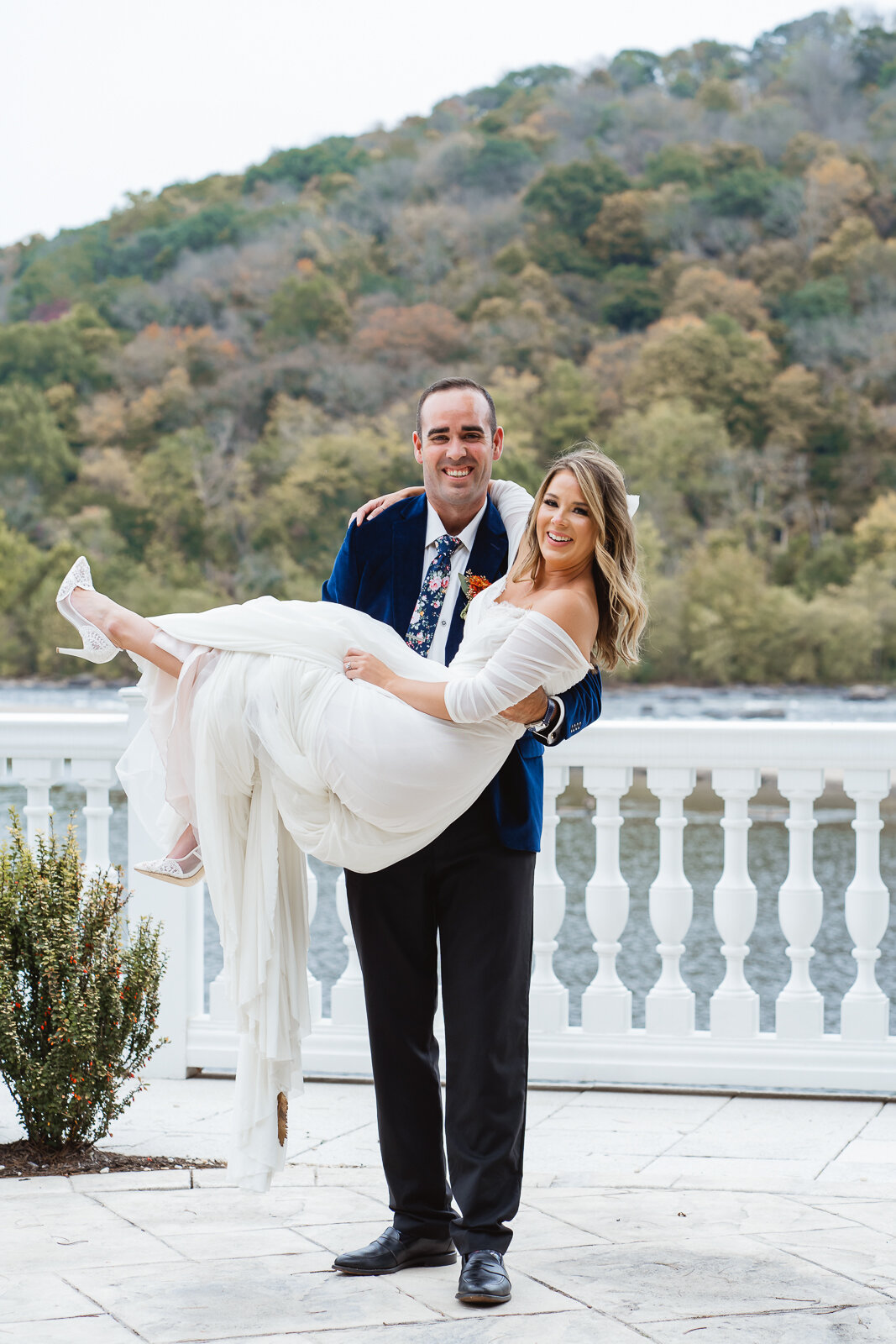 groom-carries-bride-portrait.jpg