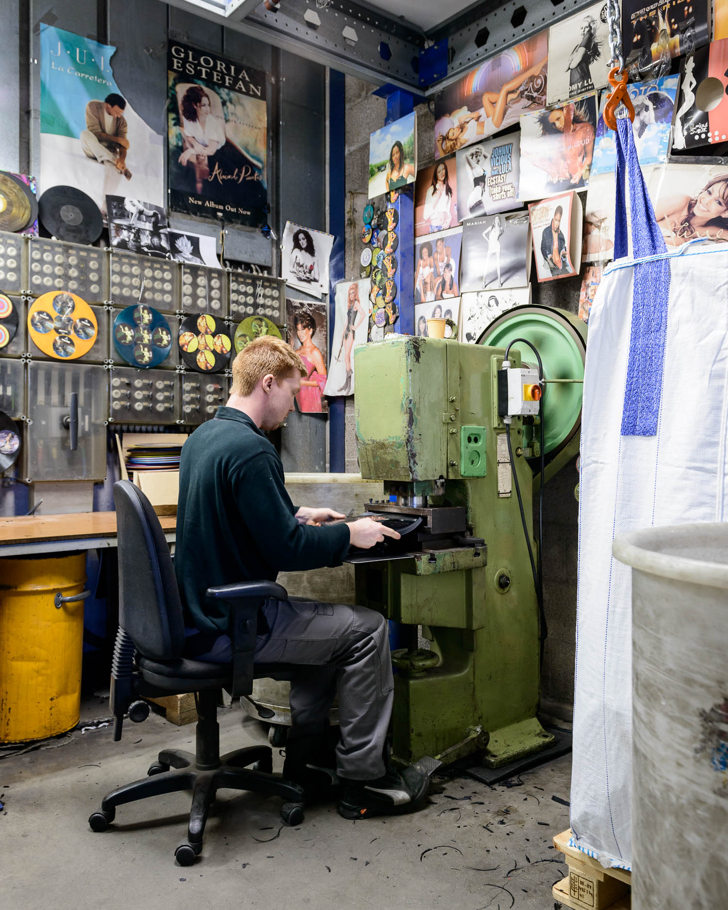  Punching the labels out of rejects so that the PVC can be recycled into floor tiles and plastic poles 