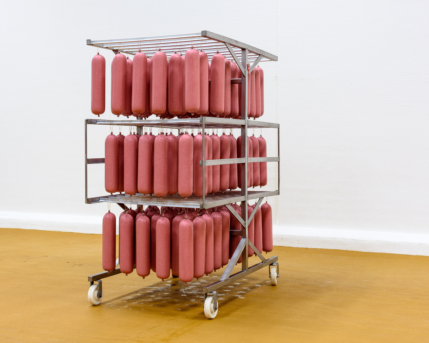 Freshly stuffed salami—weighing around three kilos each—before being cured and sliced, at Tulip's Gøl sausage factory in Svenstrup, Denmark.