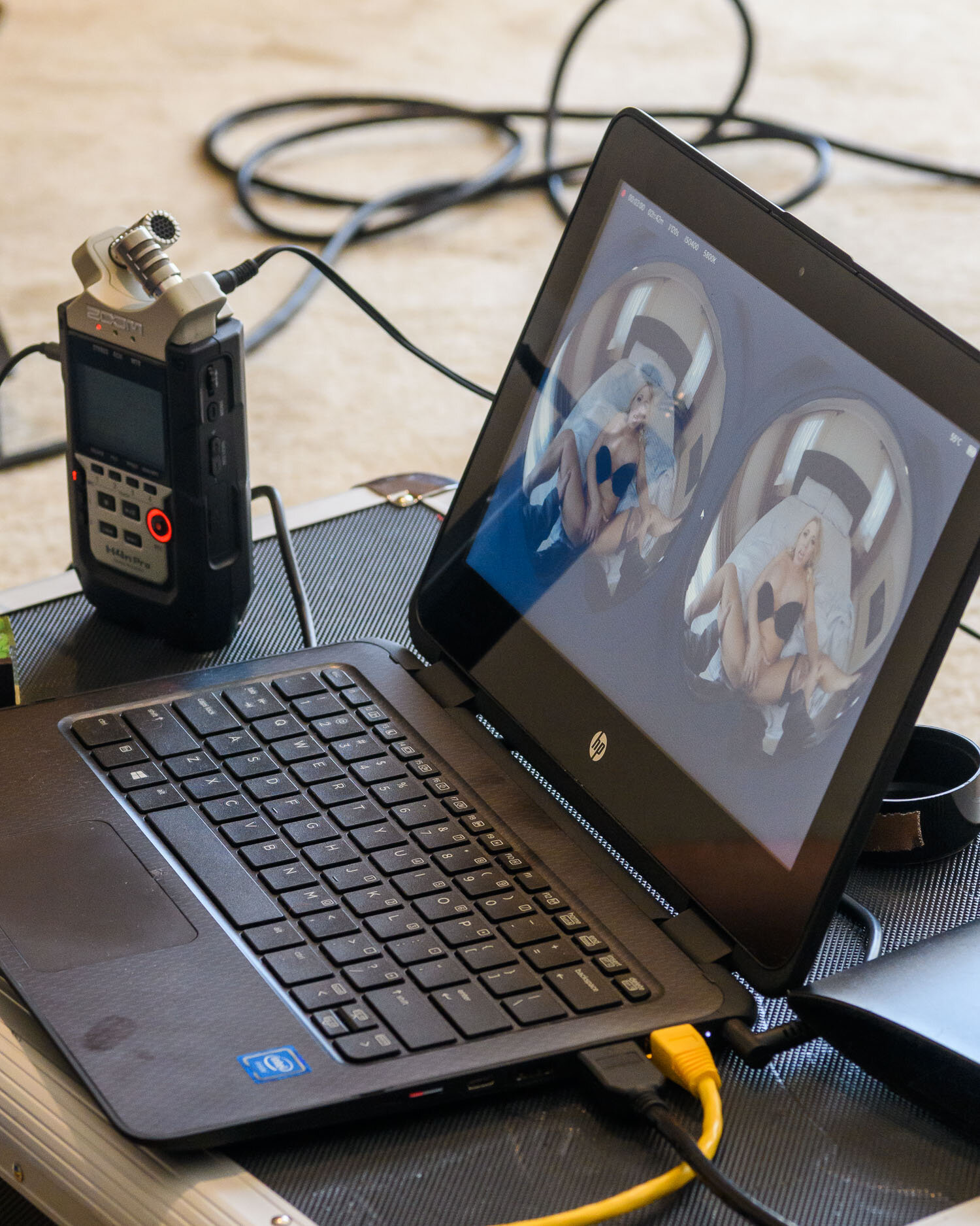  180 degree video from two cameras is previewed on a laptop on set. 