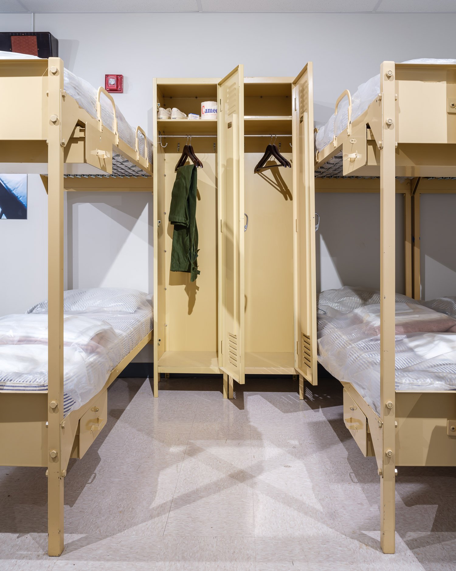  Dormitories. The dormitories comprise 18 rooms, each built to house 60 people in metal bunk beds. There is also a kitchen and a 400-seat cafeteria, which was at one point decorated with fake windows featuring scenic views. 