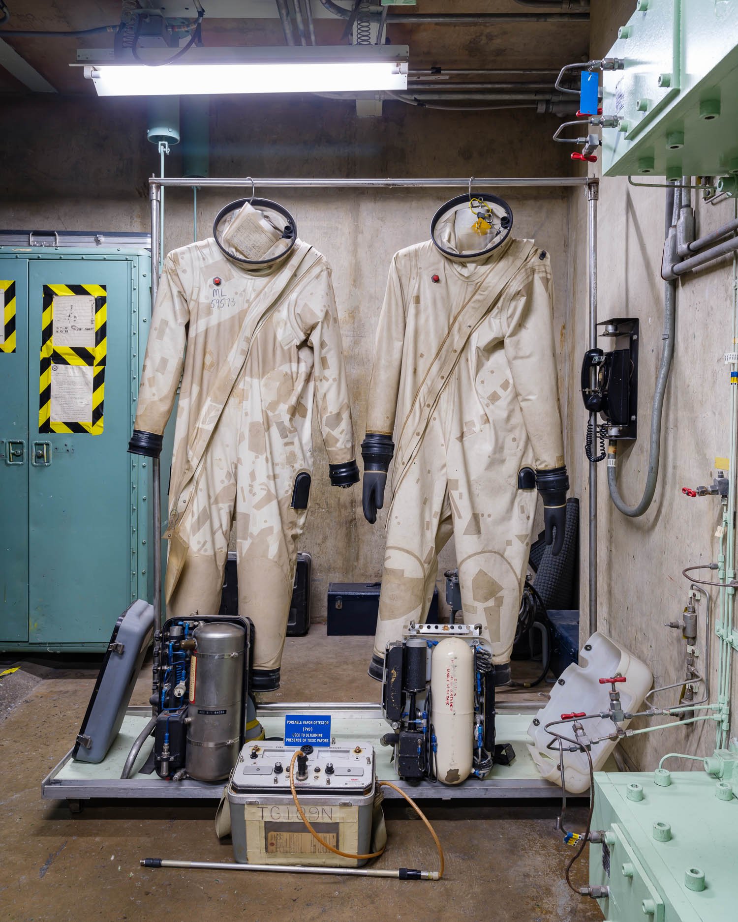  Rocket Fuel Handler's Coverall Suits (Refco) at a Titan II Nuclear Missile Silo, Arizona, USA. The fuels and oxidizers used in the rockets were extremely dangerous, and technicians spent a year just learning how to work in these suits. 