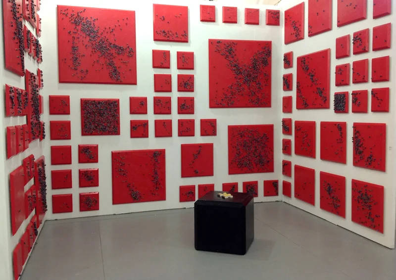 The Red and the Black, 2012. Installation view at Untitled Art Fair, Miami, 2012. Installation of 91 oil on wood and dice paintings 14 x 9 x 12 ft. Photo courtesy of Y Gallery.