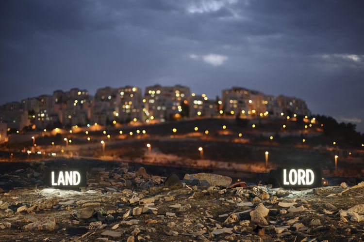 LAND LORD, Two on-location light boxes, looking onto the Israeli settlement Har Homa from the Palestinian Village Umm Tuba, annexed by Israel in 1967, 2014, digital c-print, 28.5" x 40" and 48" x 72", from the series Facts On The Ground