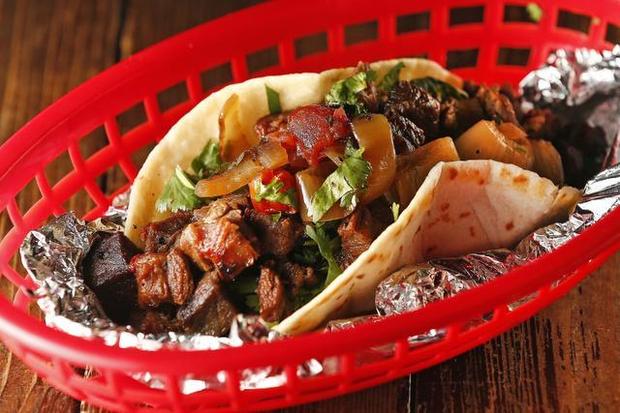 DEL NORTE TACOS Home: 101 E. Hwy 171, Godley, TX Owner & Pitmaster: Chris Garcia With mesquite-smoked meats infused into signature Mexican dishes, chef Chris Garcia has created a Tex-Mex BBQ destination in the small town of Godley, Texas. Chris originally converted a small 1927 gas station into a taco stand with a single pit, but thanks to rave reviews from countless food critics, Del Norte now attracts crowds from all over Texas. Del Norte patrons come to experience a laid-back patio atmosphere and what Texas Monthly called the "most colorful presentation of smoked meat found in the state." Read More: https://www.yelp.com/biz/del-norte-tacos-godley