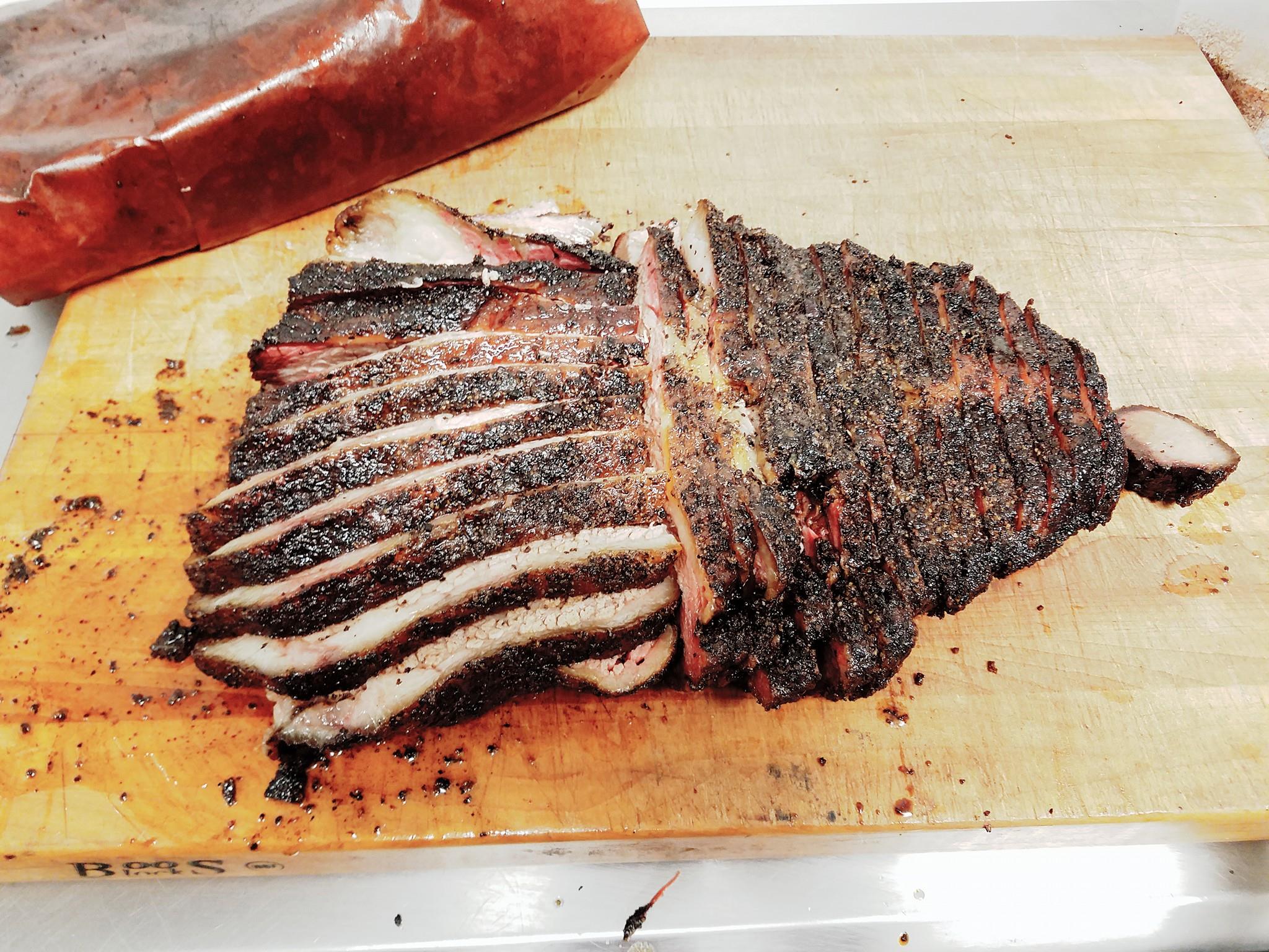 FLORES BARBECUE Home: 400 S Colorado St., Whitney, Texas Owner & Pitmaster: Michael Wyont Recently named one of the 10 Up-and-Coming Texas BBQ joints by Wide Open Spaces, Flores Barbecue is quickly becoming more than a under-the-radar bbq joint. You’ll find Flores Barbecue , which opened last year, in a little food truck on Colorado Street in Whitney, but they’re only open Thursday, Friday and Saturday from 11 AM until they are sold out. Sometimes everything is gone in less than three hours. Peppery, oak smoked meats coupled with fresh sides and pickles makes Flores a must. Read More: https://tmbbq.com/flores-barbecue-2016/