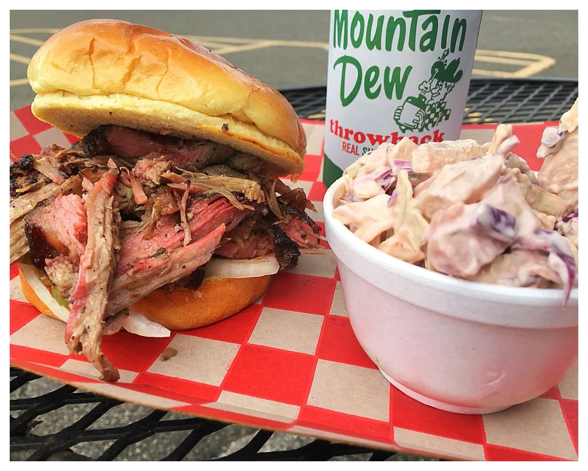 HONKY TONK KID BARBECUE Home: Westview Village (Waco Drive and Valley Mills), Waco, Texas Owner & Pitmaster: Davie Gorham A newcomer to the Texas barbecue scene, owner and chef Davie G was first introduced to BBQ at the ripe age of 5 years old at a friends backyard party, amazed everyone by devouring 2 smoked pigs feet, and taking a third home for later munching. His father started teaching the ways of the smoker and grill at age 10. After a stint at Texas A&M Galveston and couple years in Culinary School at TSTC, David jumped in to the professional culinary ring as a Culinary Coach at HEB, grill cook at Austins on the Ave, and eventually worked his way up to pit-master of Uncle Dan's Barbecue in early 2014. He has since travel internationally and recently landed back in Waco to start serving up Global Fusion BBQ. Read More: https://tmbbq.com/honky-tonk-kid-bbq-2017/