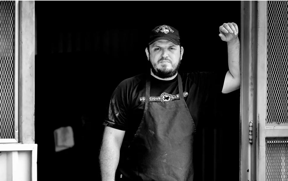 BODACIOUS BAR-B-Q GLADEWATER (TEXAS MONTHLY TOP 10) Home: 1105 West Upshur Avenue, Gladewater, Texas Owner & Pitmaster: Jordan Jackson Serving: Texas Pork Steaks After leading Bodacious on Mobberly (Longview) to a Texas Monthly #4 joint in the state, Jordan Jackson shifted gears and took over operations of the Gladewater location. After a recent visit, it’s clear that Jackson is at the top of his game, specializing in a simple menu where the finely smoked meats complement the peaceful, easy feeling of the small town. Jackson is a trained chef who has quickly become known as one of state’s top pitmasters thanks to mixing classic recipes with East Texas twist - and we can’t wait to see what his skills do with the old-school Texas cut - the pork steak. Read More: https://www.texasmonthly.com/bbq/bodacious-bar-b-qs-jordan-jackson-gets-back-to-his-barbecue-roots-in-gladewater/