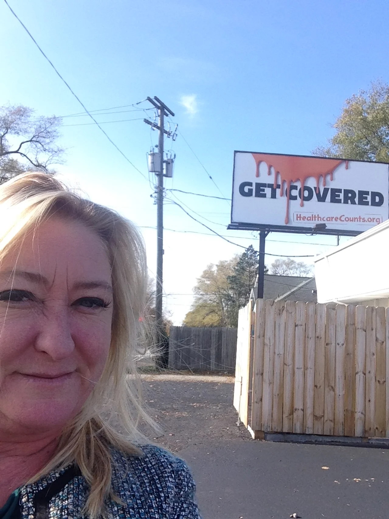 Jean with a selfie of our billboard campaign.