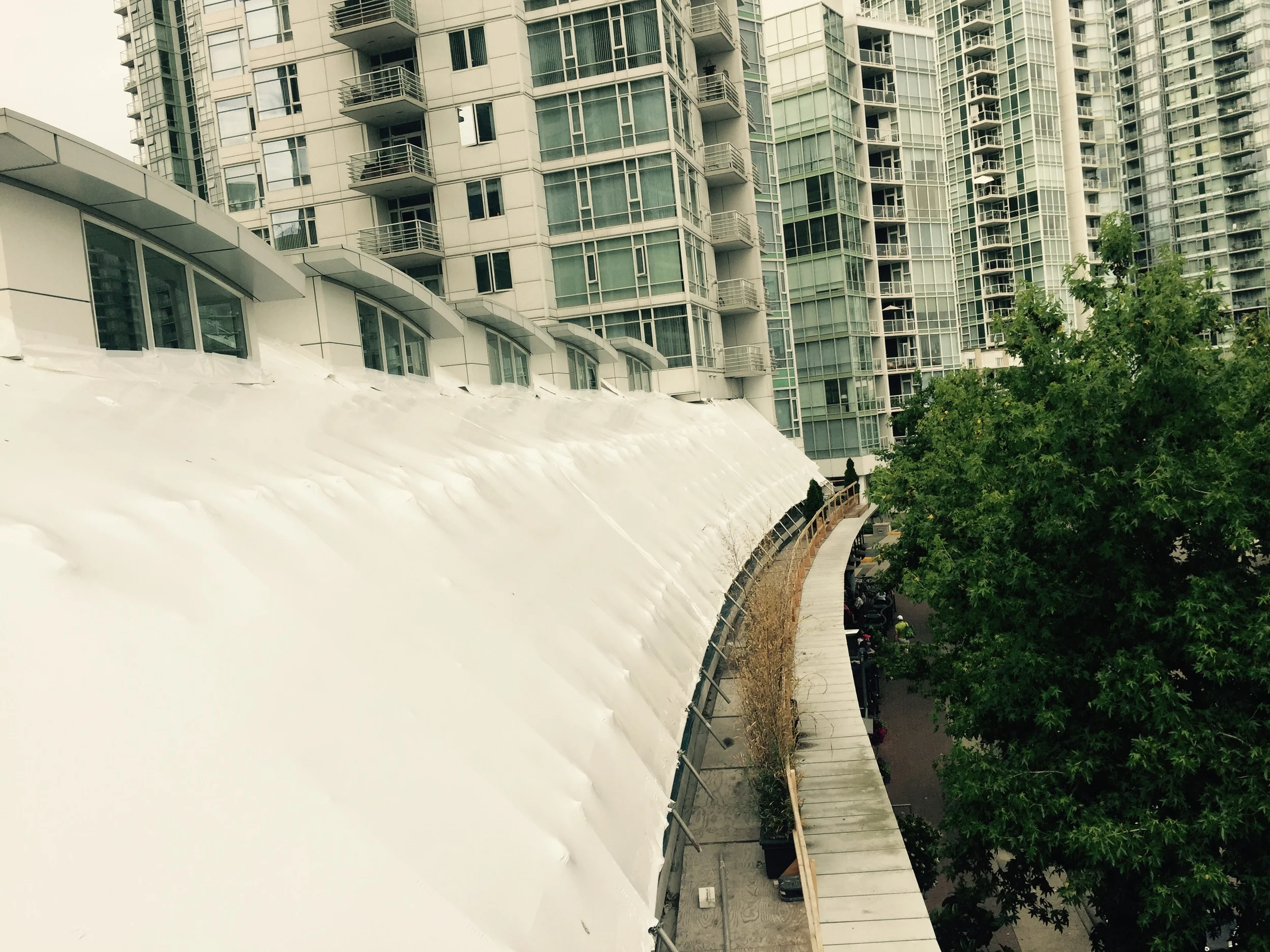 Directly below are open patios for restaurants below construction area.