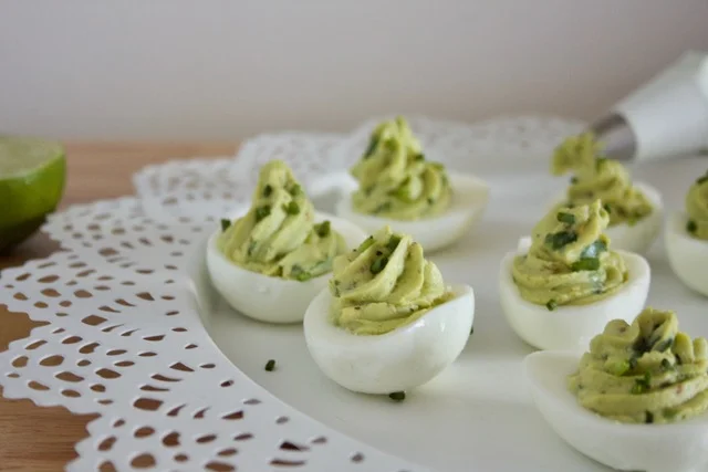 Using Avocado in place of mayonnaise for deviled eggs adds a healthy twist to a classic appetizer. They are visually appealing, and taste delicious!