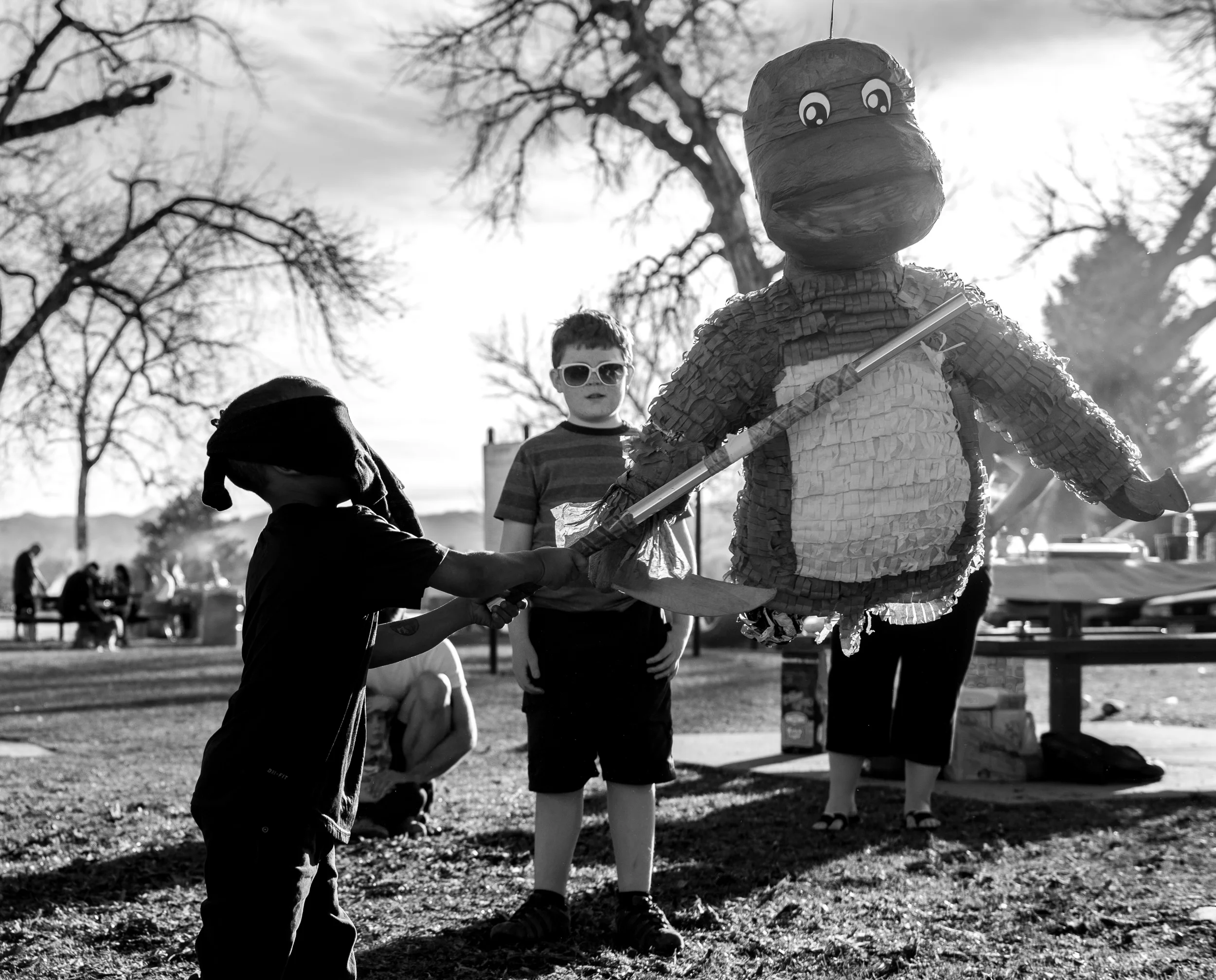 Blog - The Pen & Camera - Gratitude Journal, Inspirational, Writing, Denver, Colorado, Friendship - Molly Rees Photo - Black and White Documentary Childhood Photography - boy with pinata at birthday party by M. Menschel