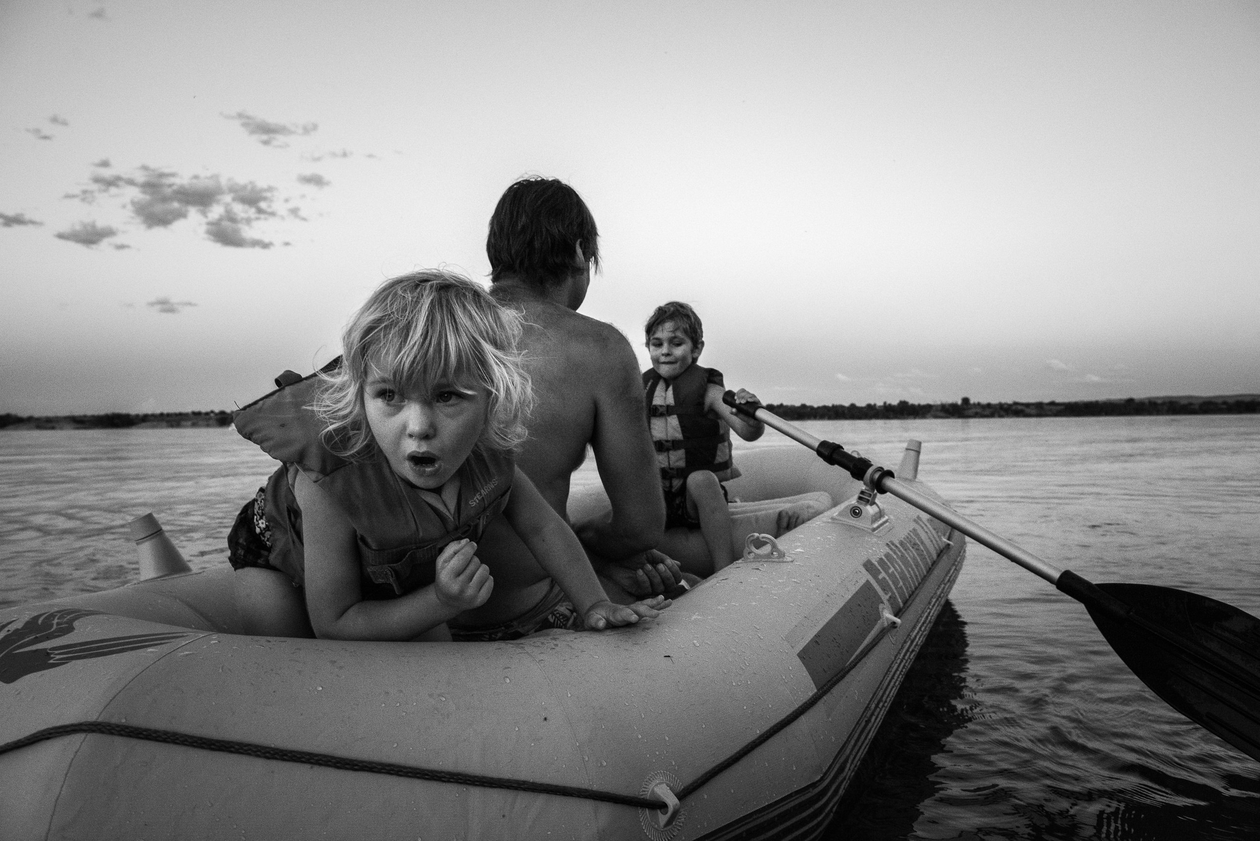 Blog - The Pen & Camera - Molly Rees Photo - Black and White Documentary Childhood Photography - children in raft at Chatfield Reservoir in Denver, Colorado by M. Menschel