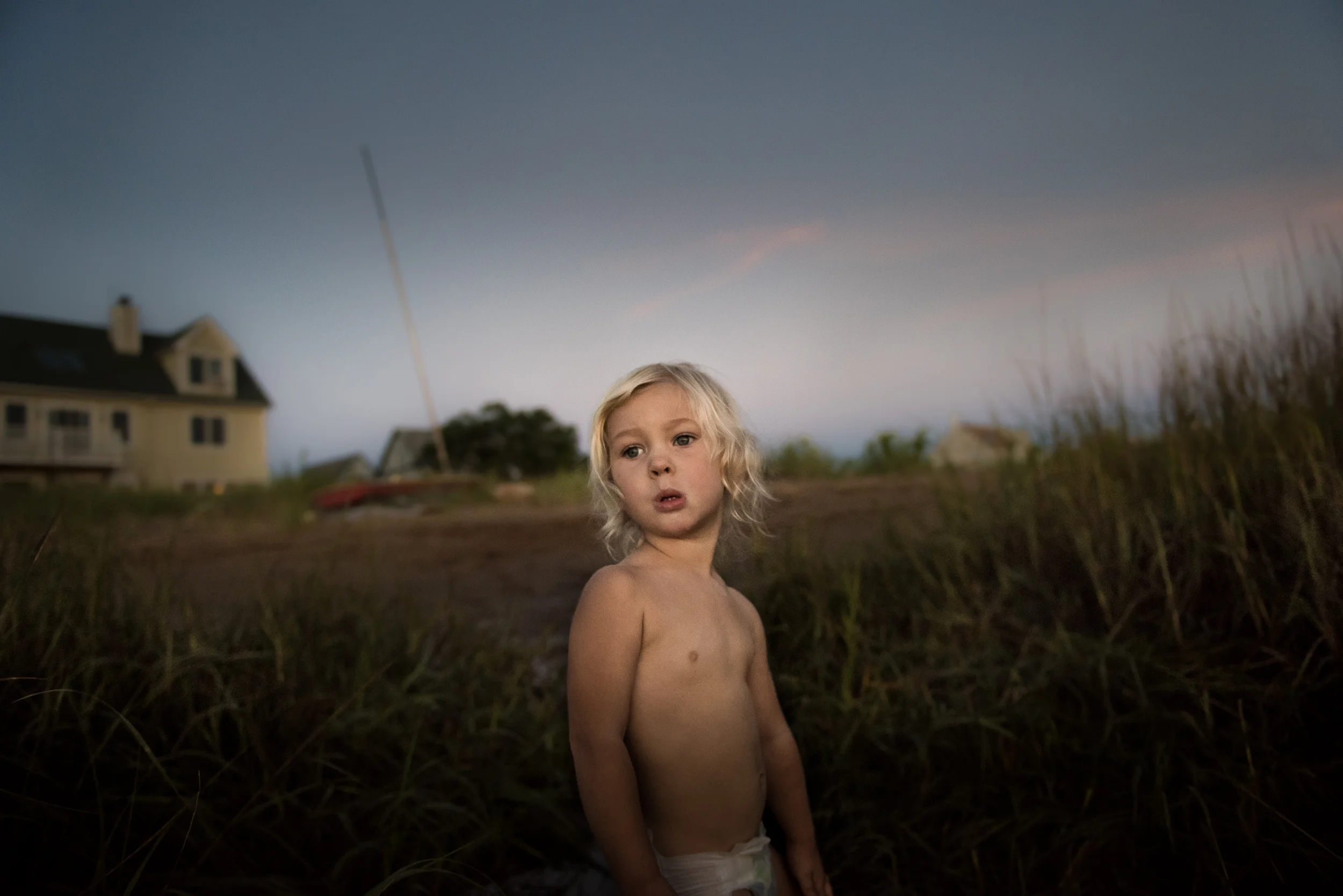 Blog - The Pen & Camera - Inspirational, Writing, New England - Molly Rees Photo - Documentary Childhood Photography - girl with sailboat by basin on Plum Island in Newburyport Massachusetts by M. Menschel