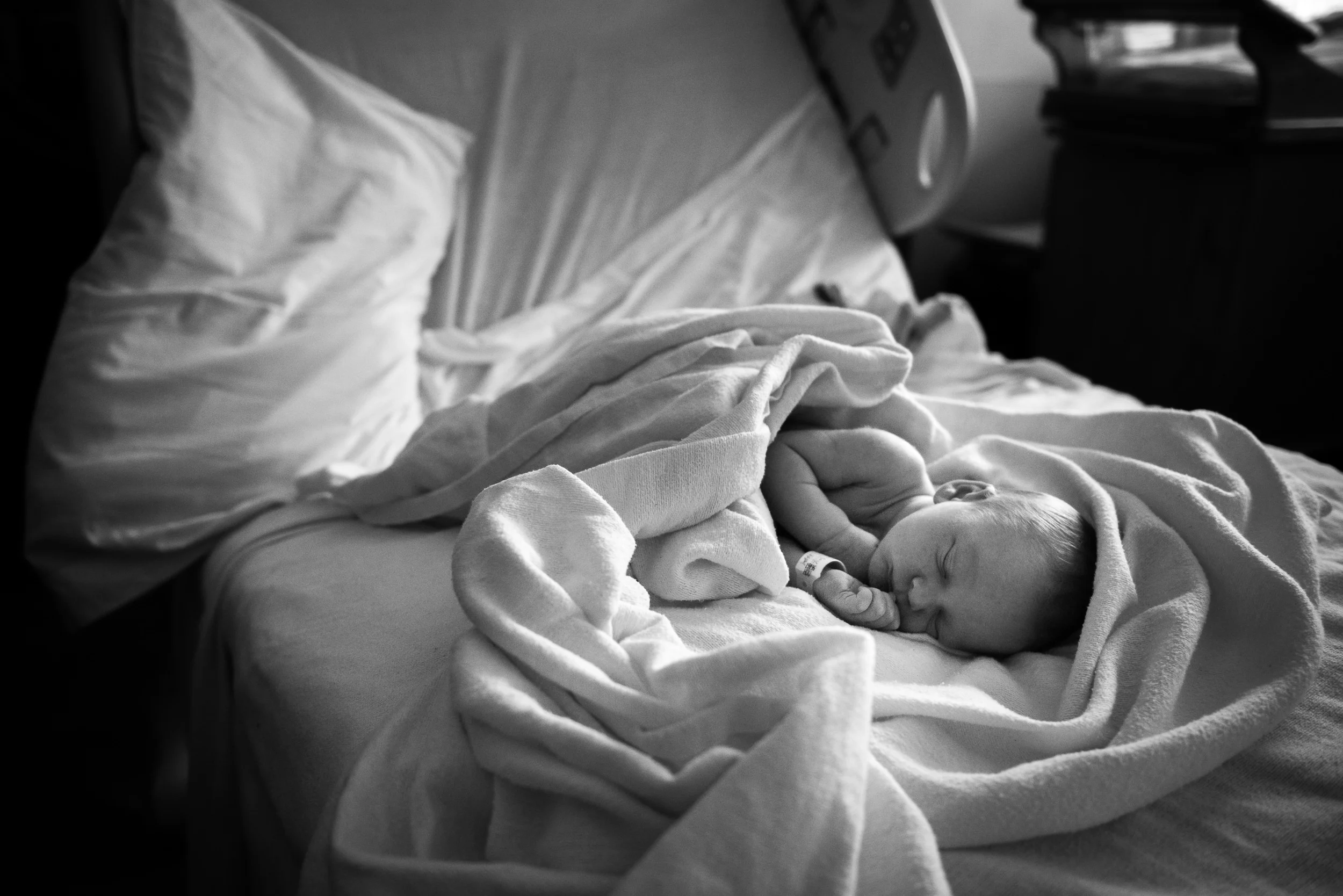 Writing Blog - The Pen & Camera - Inspirational, Motherhood, Birth, Fresh 48 - Molly Rees Photo - Black and White Documentary ChildhoodPhotography - Portrait of newborn baby asleep in hospital bed by M. Menschel