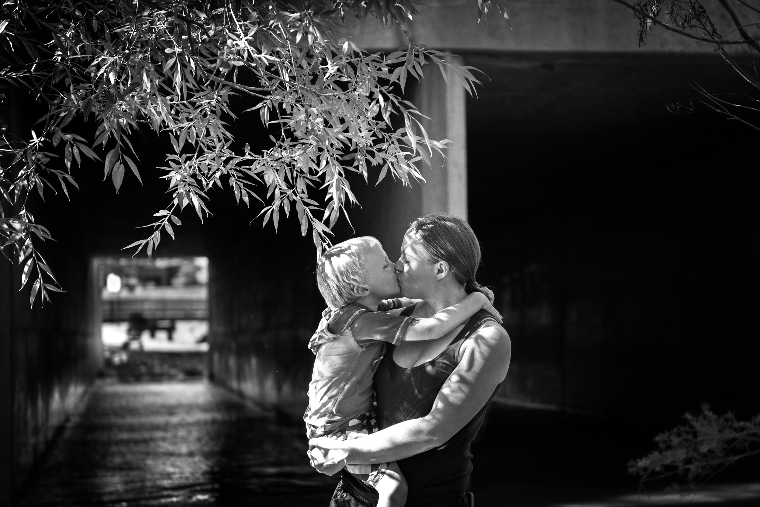 Blog - The Pen & Camera - Molly Rees Photo - Black and White Documentary Childhood Photography - mother holding boy at Belleview Park in Denver, Colorado by M. Menschel