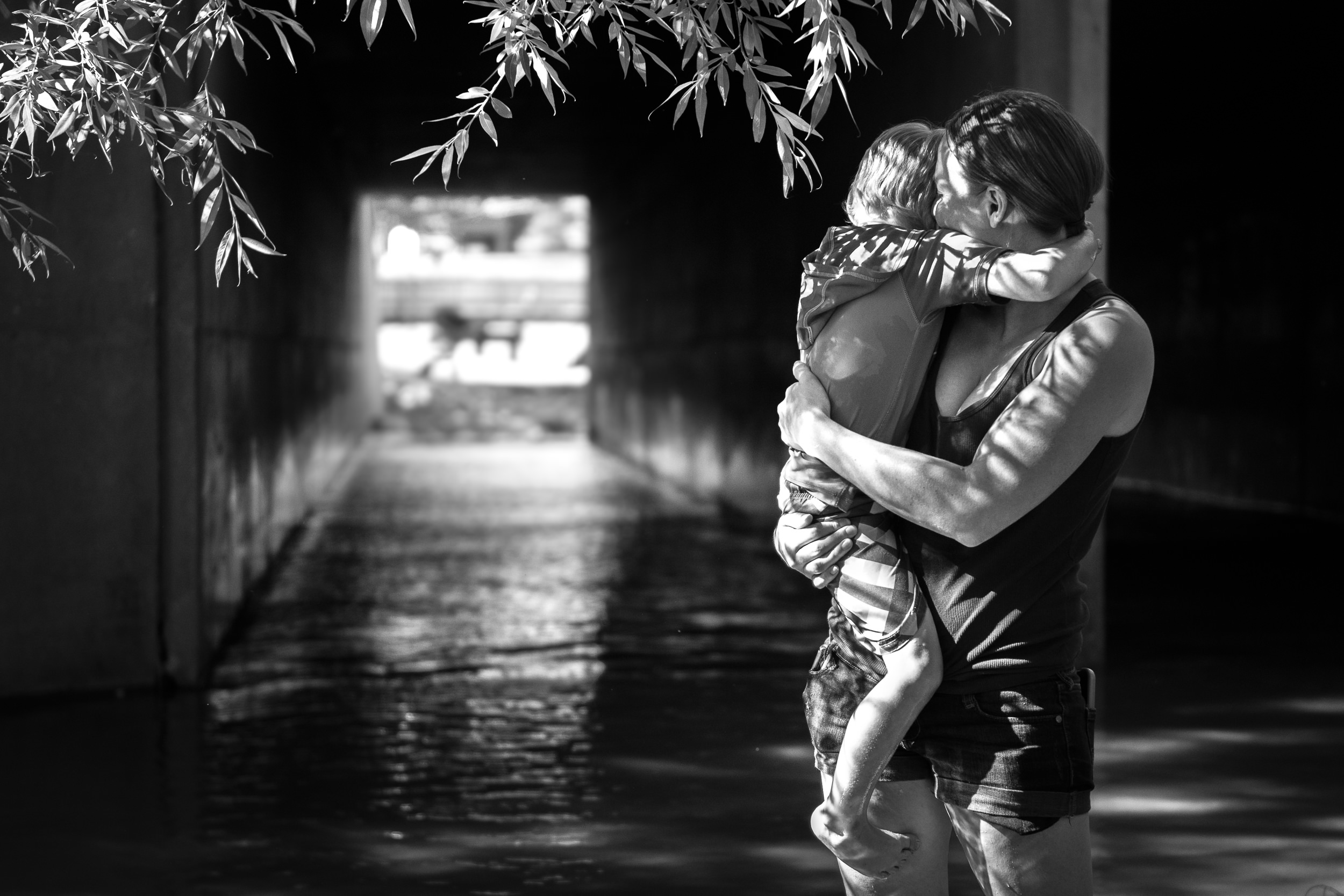 Blog - The Pen & Camera - Molly Rees Photo - Black and White Documentary Childhood Photography - mother holding boy at Belleview Park in Denver, Colorado by M. Menschel