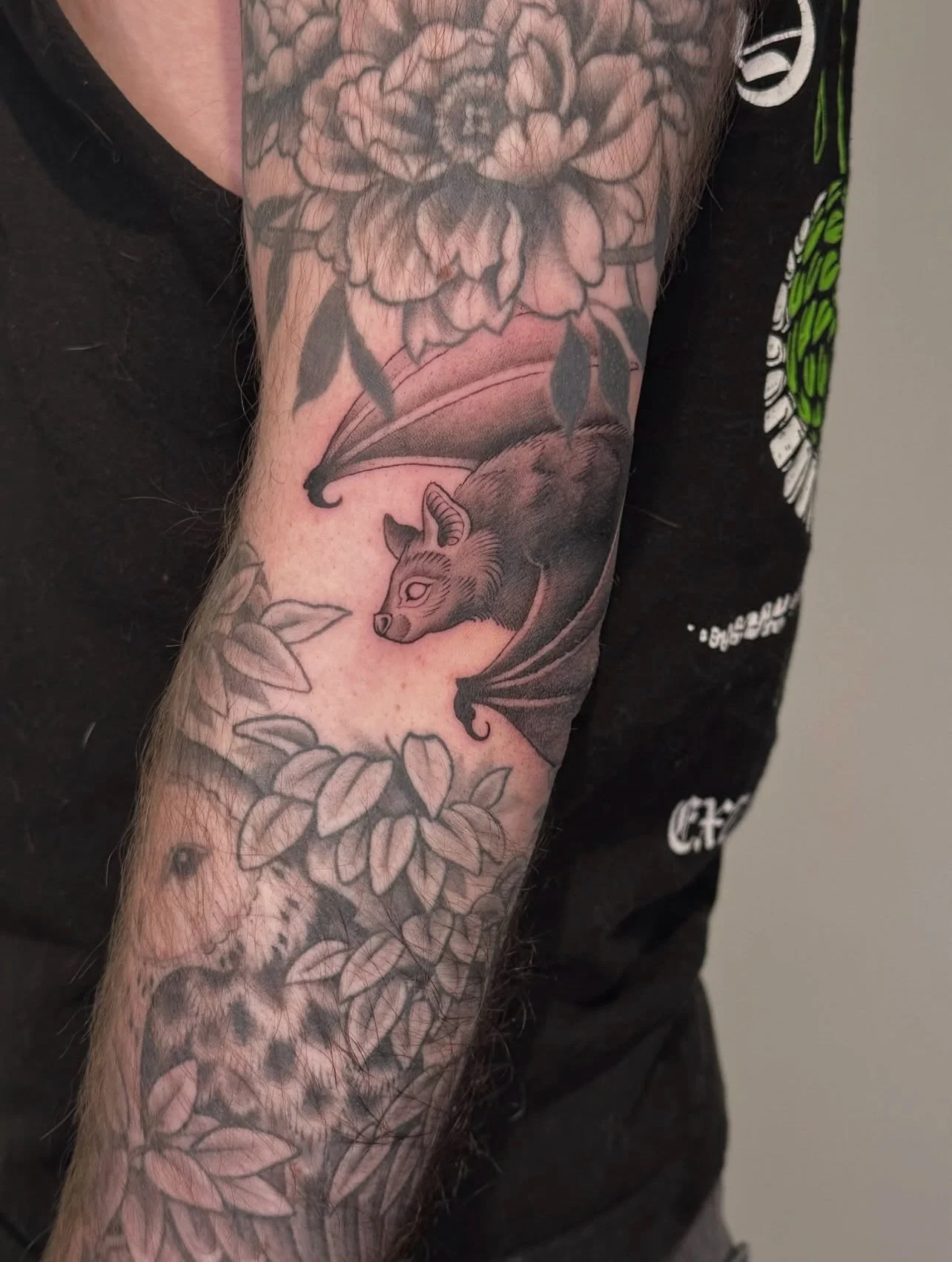 Lil bat tucked in above a healed barn owl &amp; botanicals, part of a sleeve by @lauramercy.tattoo