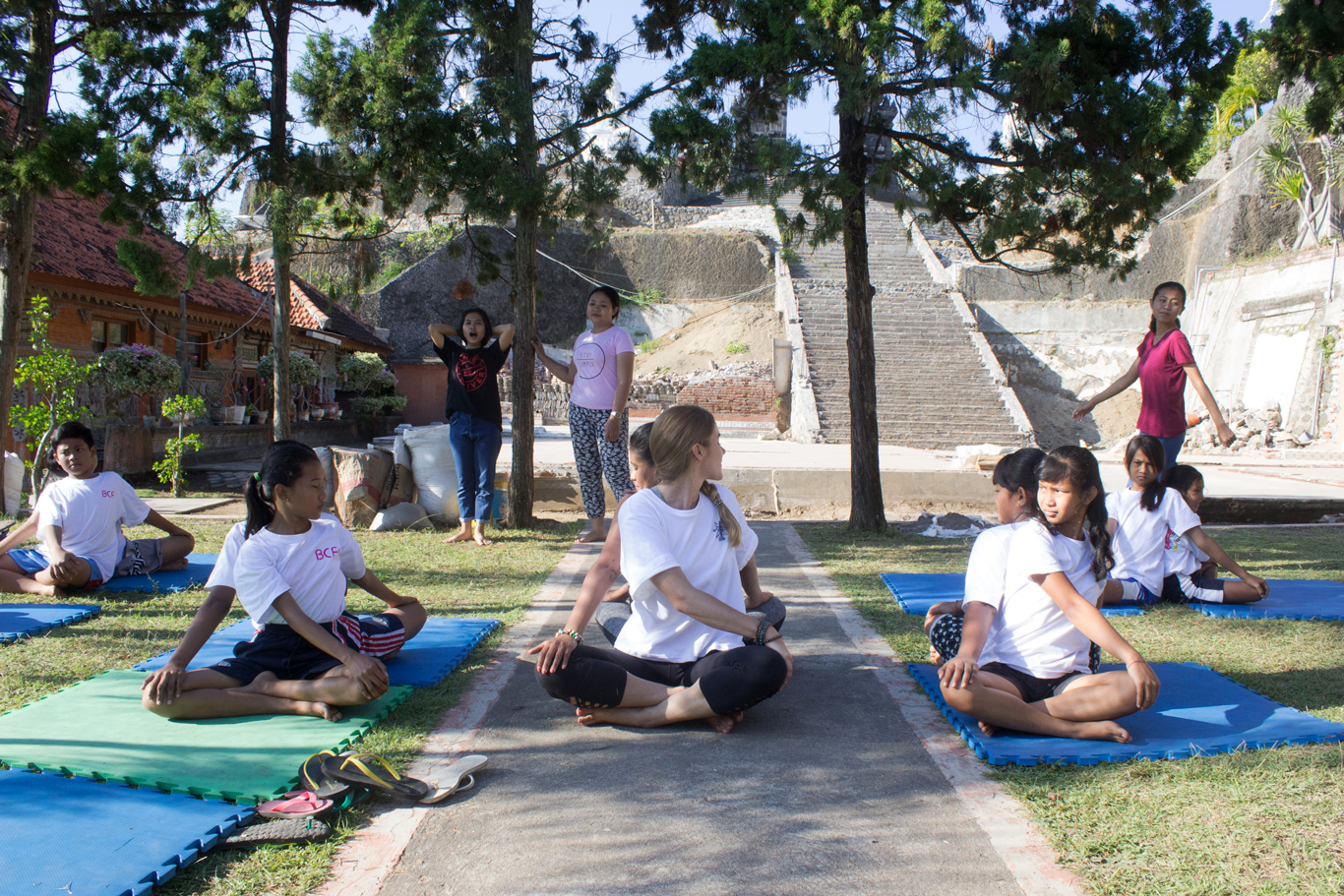 Yoga Teachers Kimberly and Maggy demonstrating partner seated twist