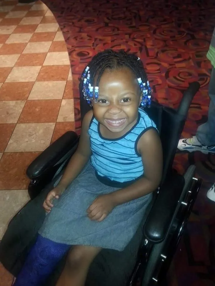 Anniyah, age 4, with a defiant smile after being attacked by US Marshals, FBI, & OPD. Photo by Jabari Shaw