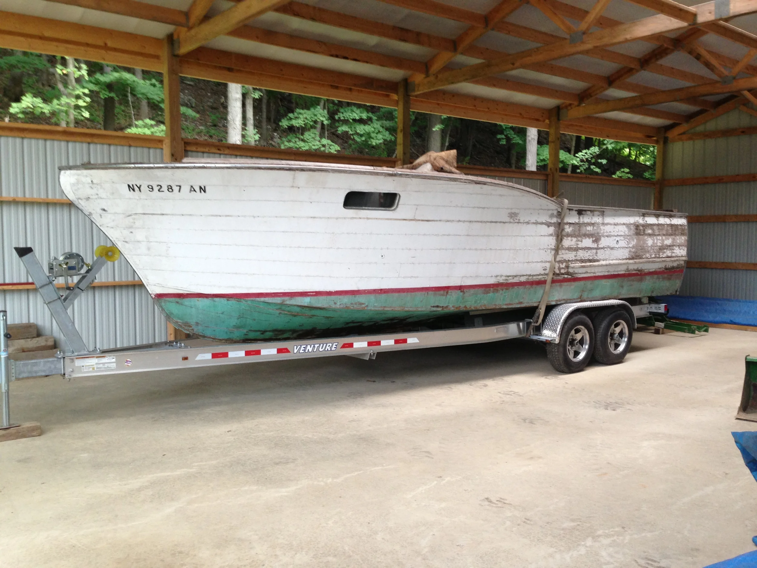 Justin and Keri Fasulo's 1957 Chris Craft Sports Express being prepped for restoration.