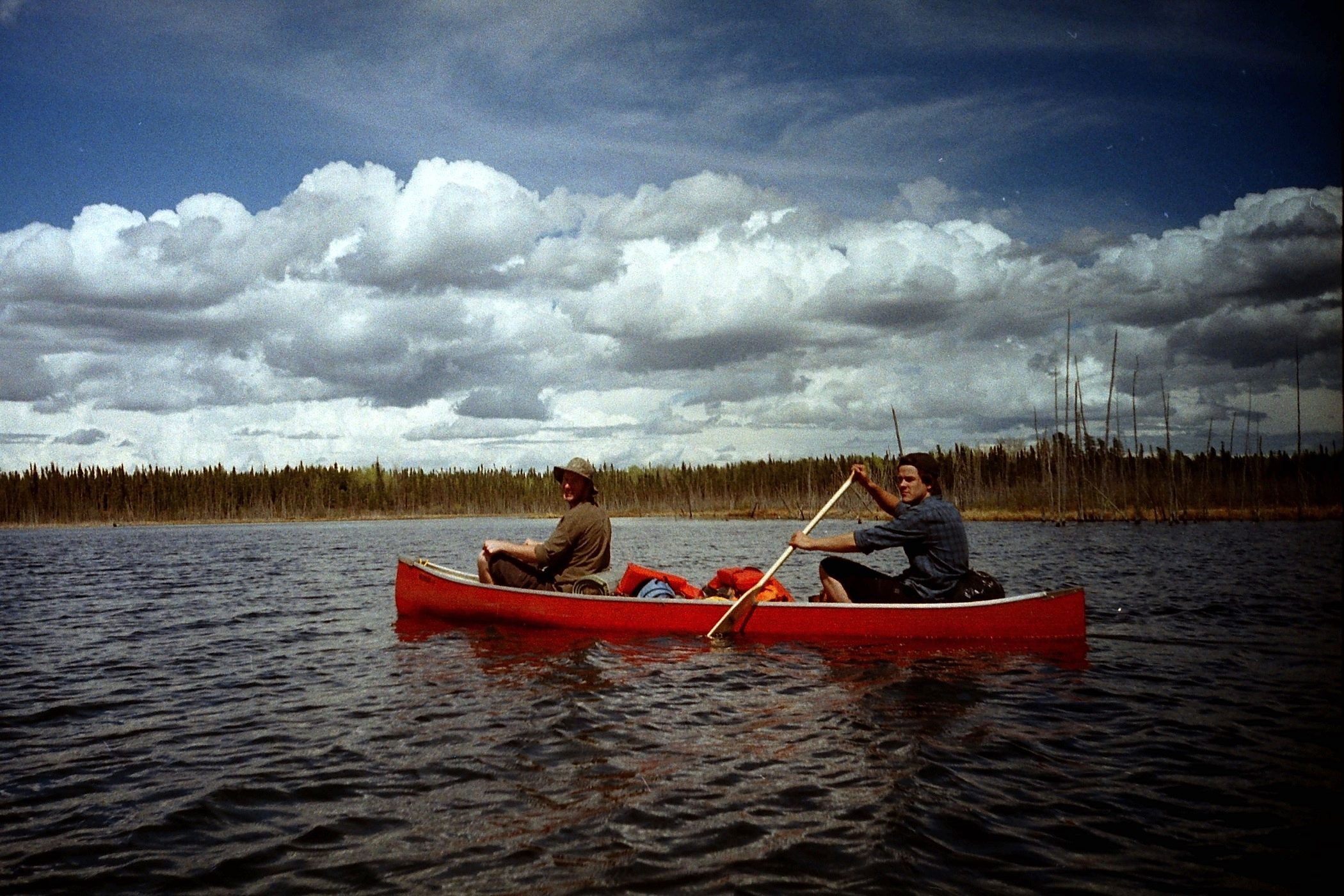 Adam, Jean-Paul (laying down) and Sean paddle through a calm section sheltered by an island. (LOMO LC-A)