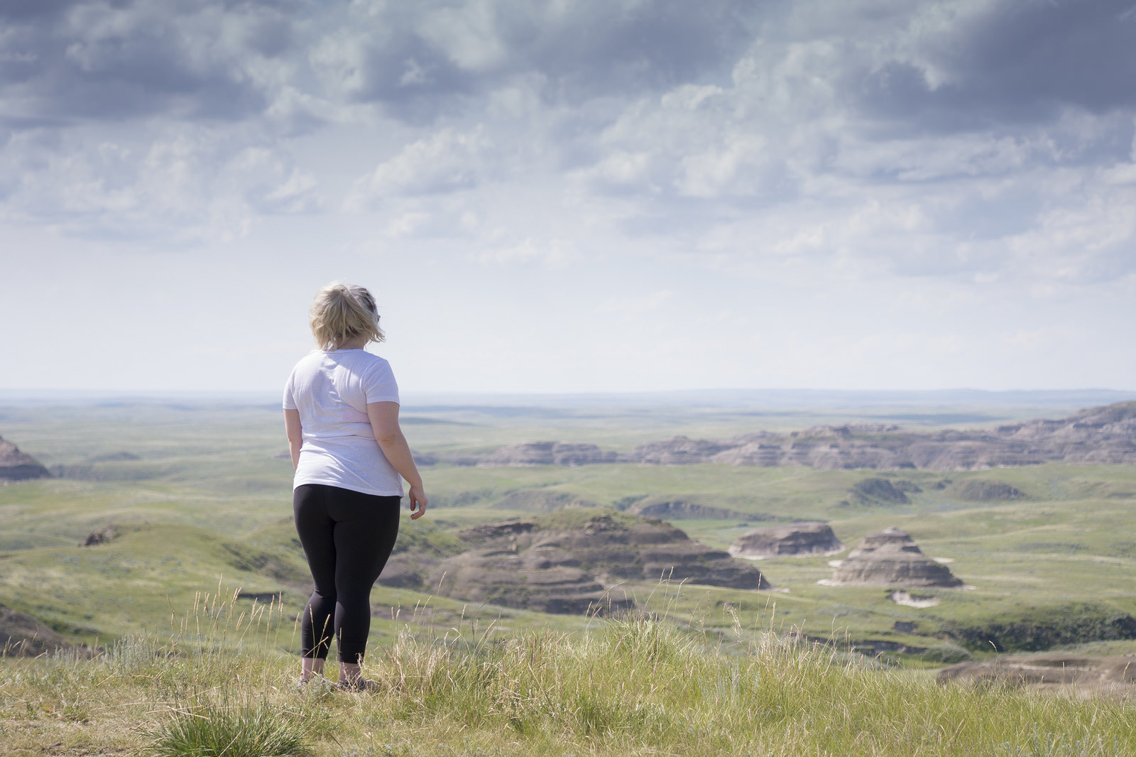 Teisha standing above the Killdeer Badlands from one of the road-accessible viewpoints.