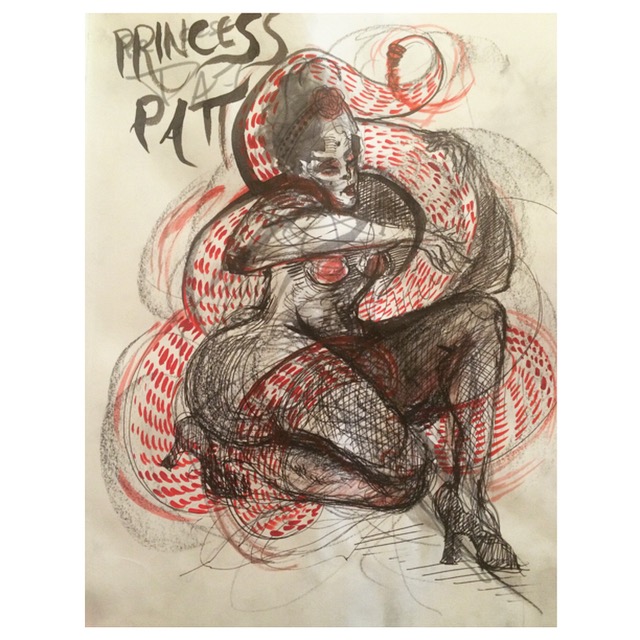 Princess Pat twisting a snake around her body.