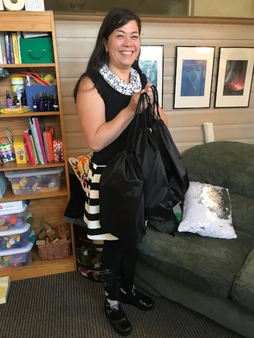 Therapist Carlyn Wierda shows off a few of the remaining Self Care Kits. Dozens have already been distributed to our youth clients.
