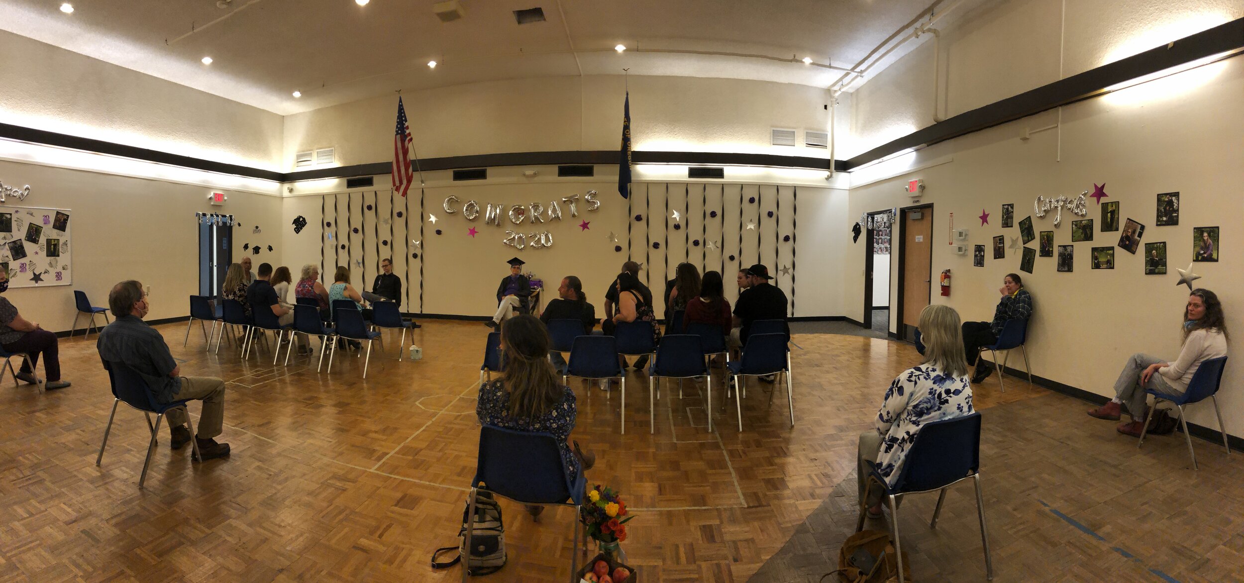 The ceremony was able to maintain social distance, seating the family of each graduate together and spacing out staff behind the families.