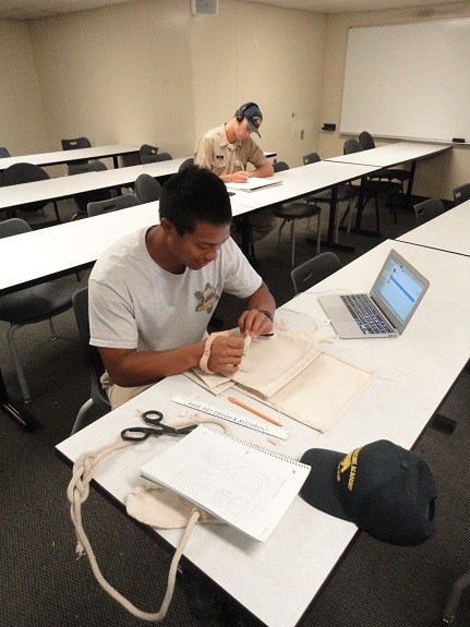 Our 2016 scholarship recipient Duke Quitevas, working on his sail bag creation while on the training cruise headed to Hawaii.