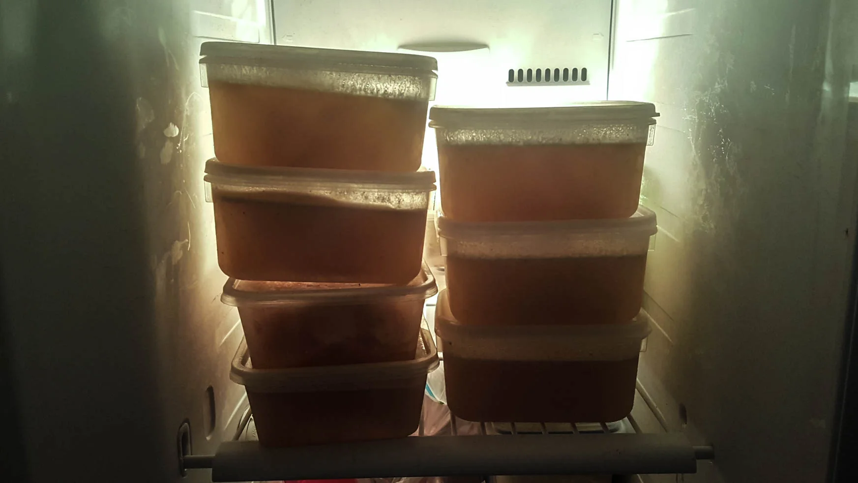 It tastes better than it looks :) Bone broth in containers ready to be heated up in the morning.