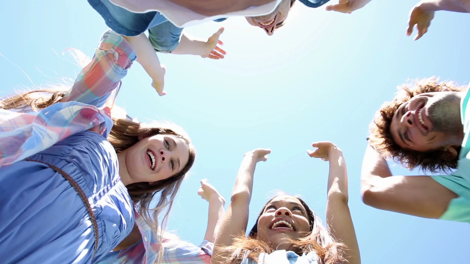 stock-footage-students-putting-hands-together-in-unity-on-college-campus.jpg