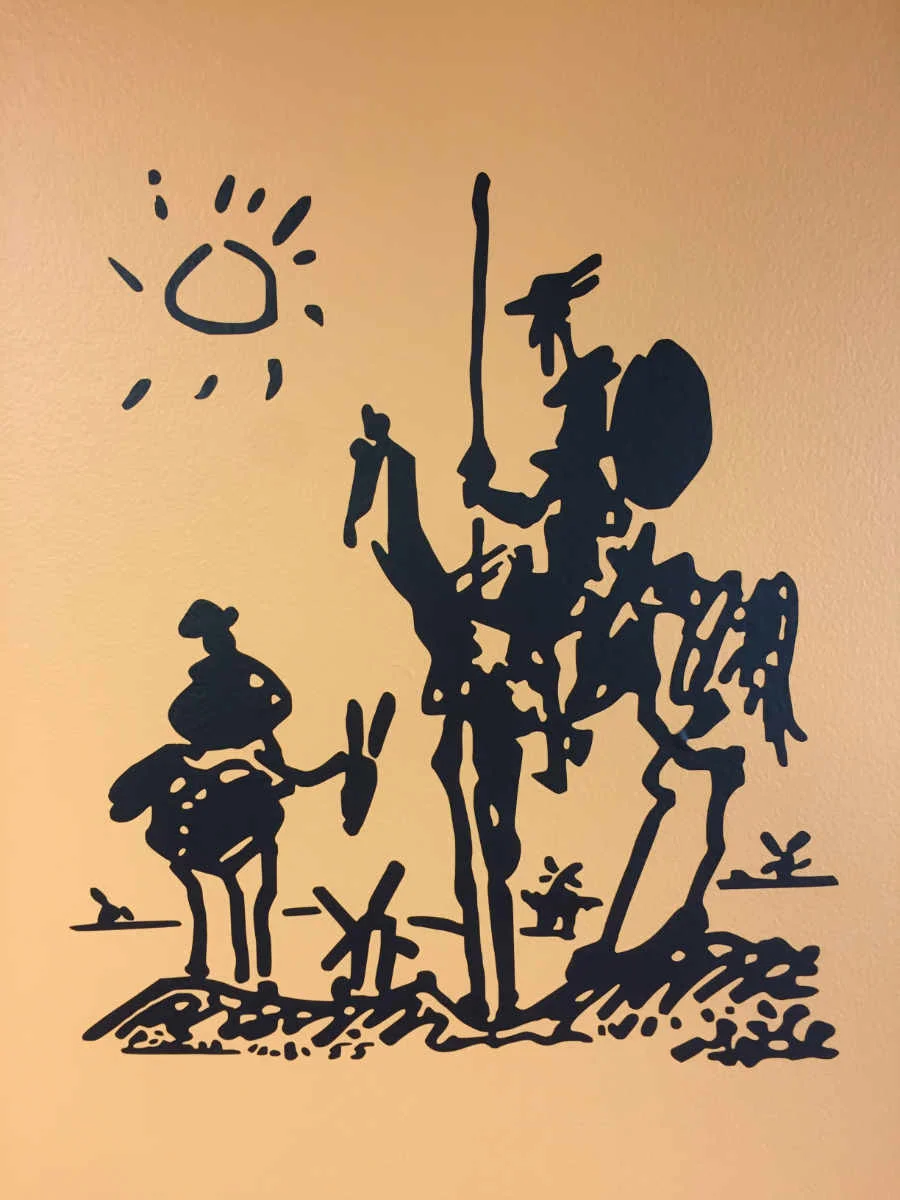 Don Quixote. 18'h x 12"w (Easy to apply)Black graphic on orange wall.
