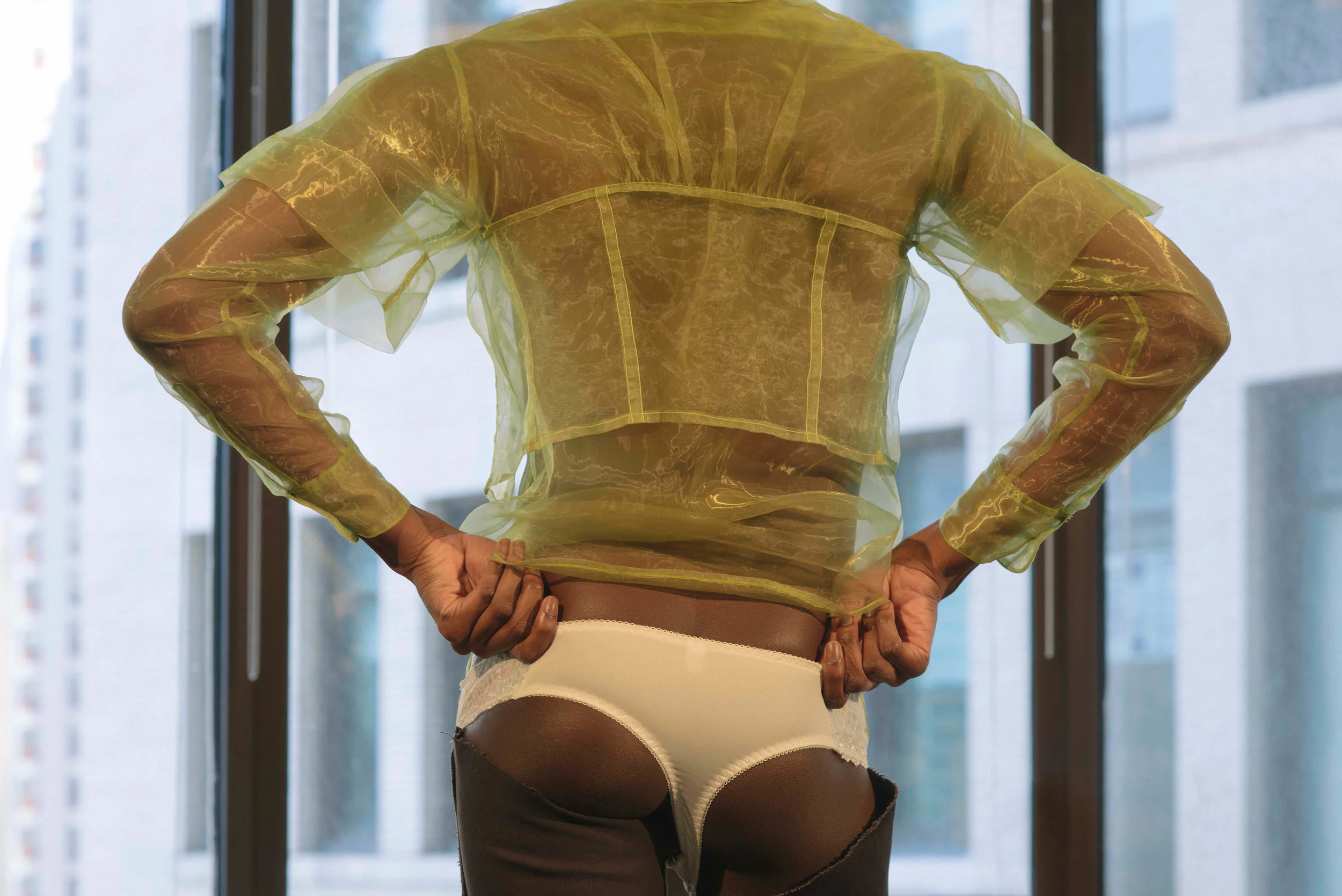 Edem wears tops Eckhaus Latta, bottoms Mlaed.