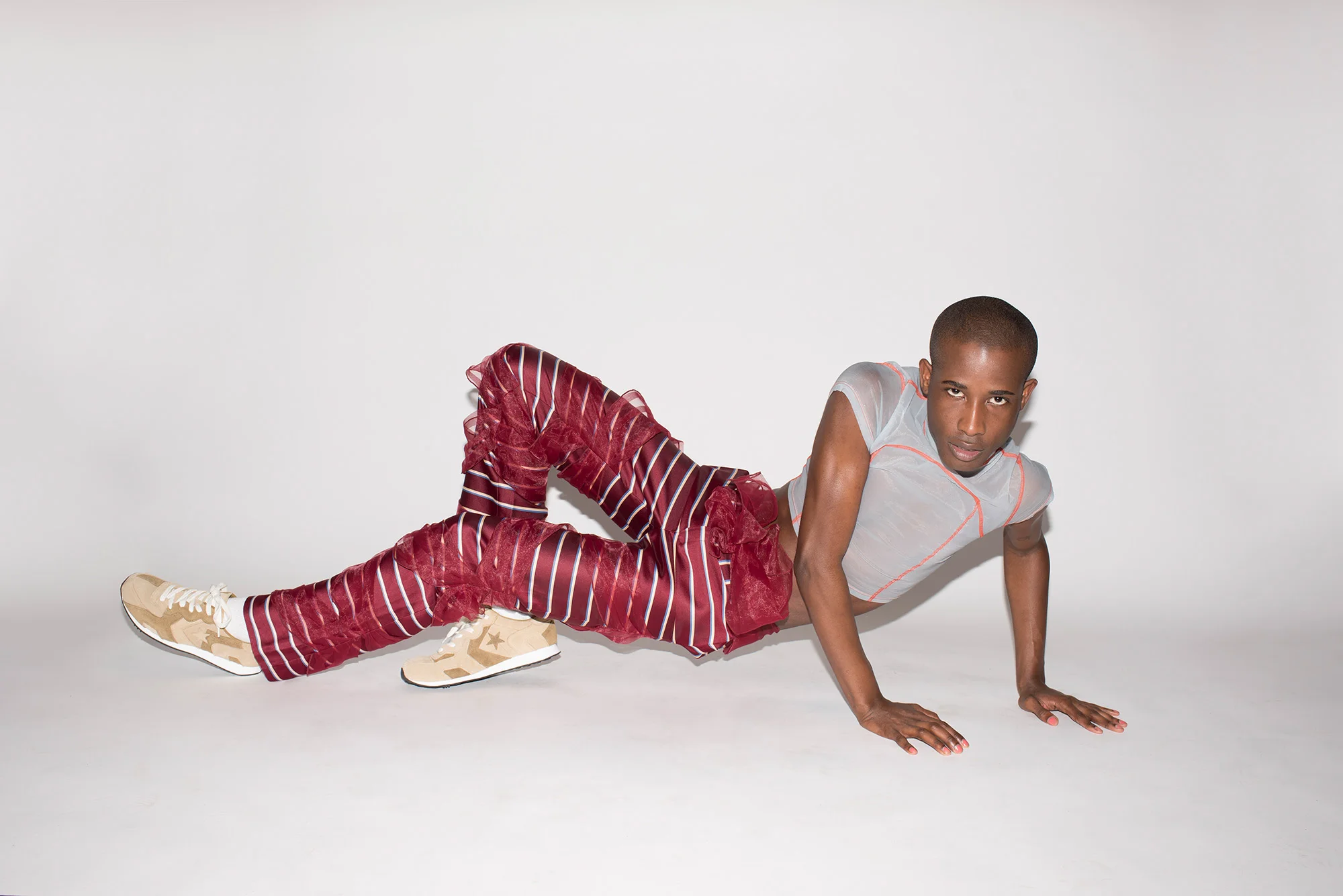 23-year-old Georgia native Cory Walker is a model and actor who wants to tell the stories of QPOC in new ways. “Working with my queer sisters who are visionaries is super important to me, because we’re the generation that’s going to take it to the next level.” On Cory: top Eckhaus Latta, pants Vasilis Loizides.