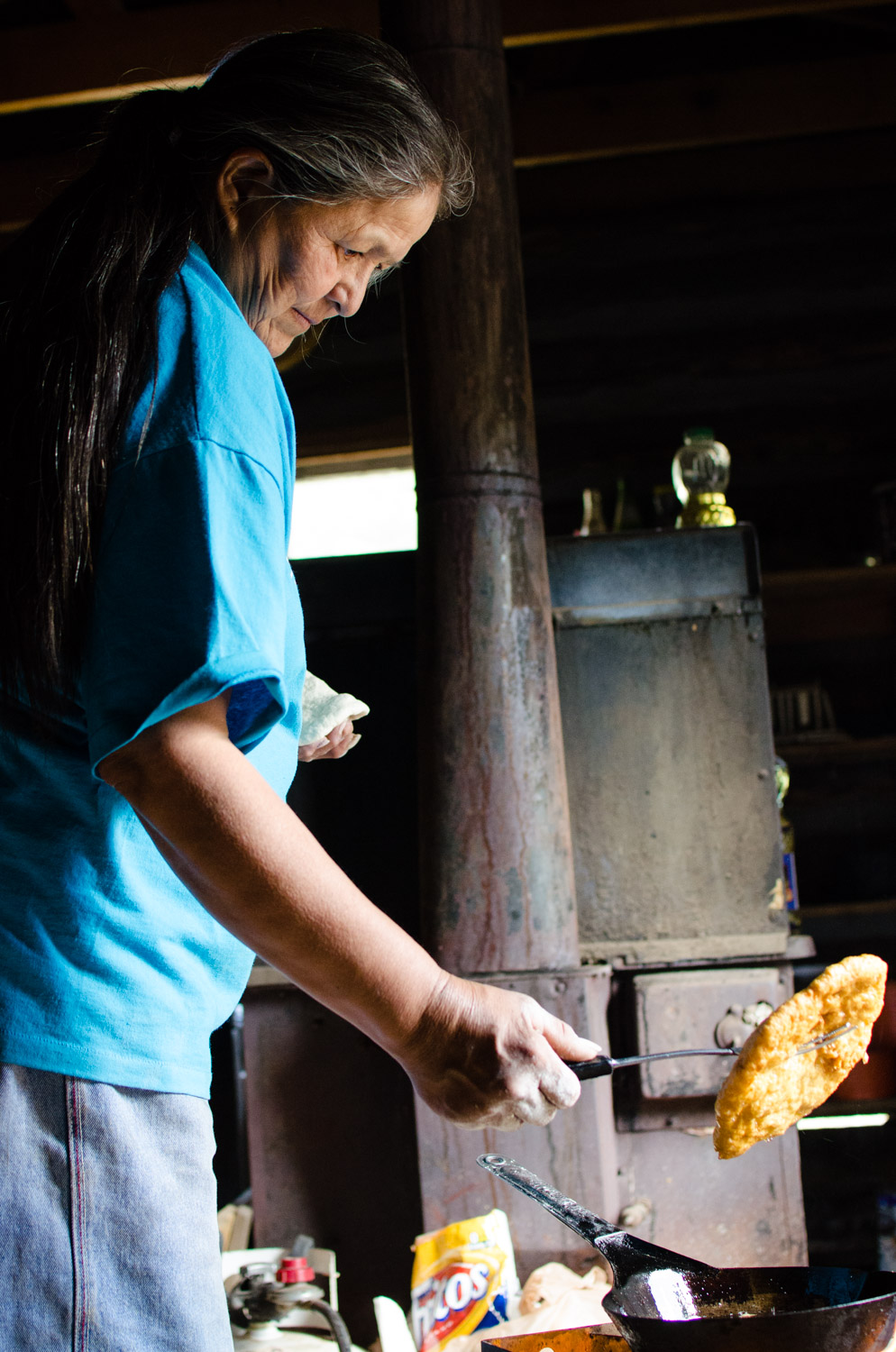 Making fry bread in a cabin in the Chuska Mountains. 